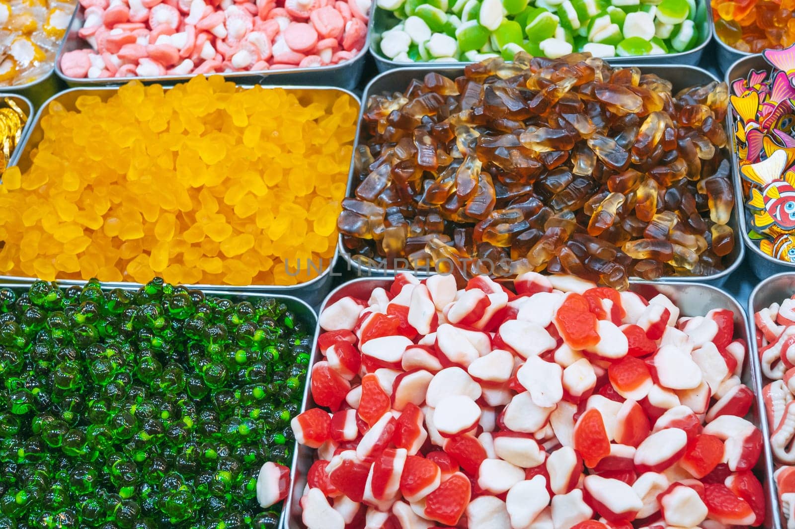 colorful marmalade and chewable candies on counter at a candy store in the oriental market in Asia