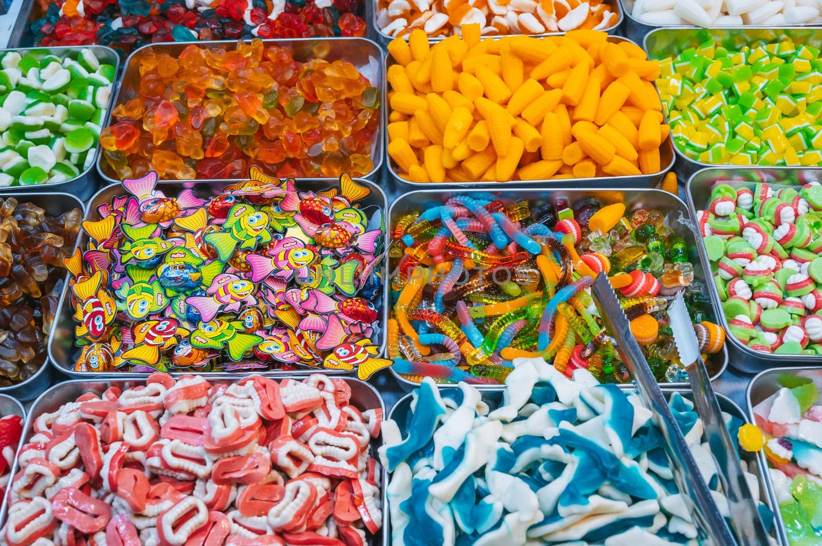 Assortment of marmalade and chewable candies on counter at a candy store in oriental market. Nha Trang, Vietnam - December 14, 2024
