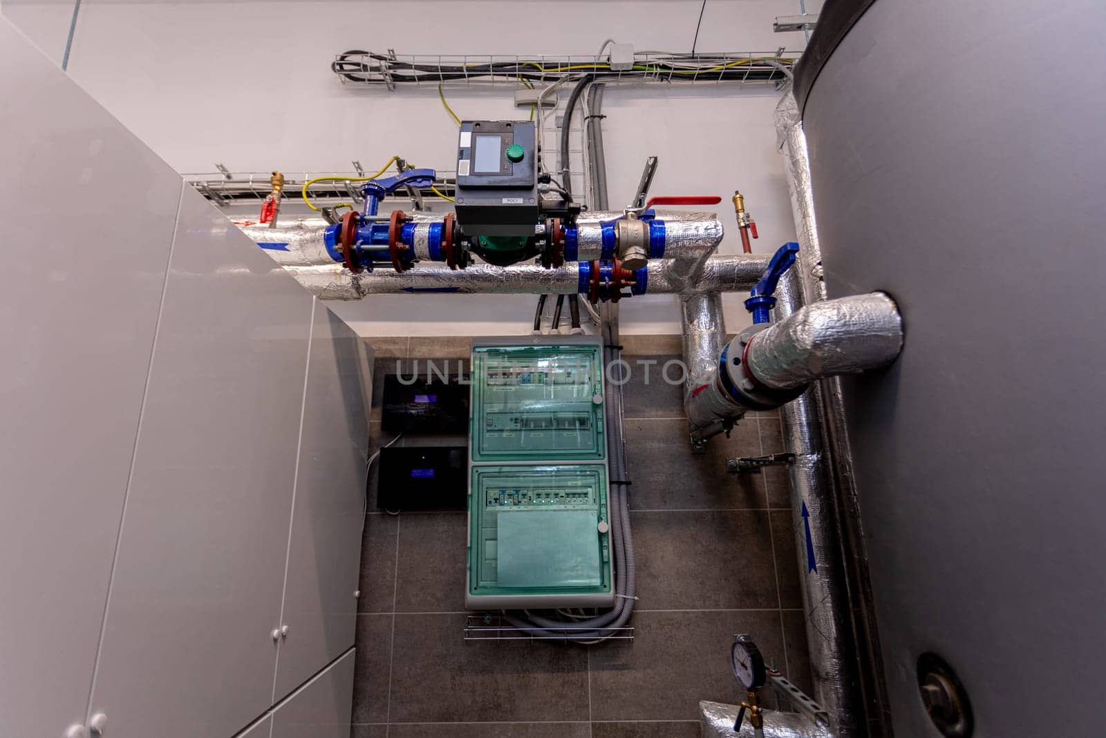 An intricate depiction of a contemporary industrial water management system incorporating pipes and various equipment