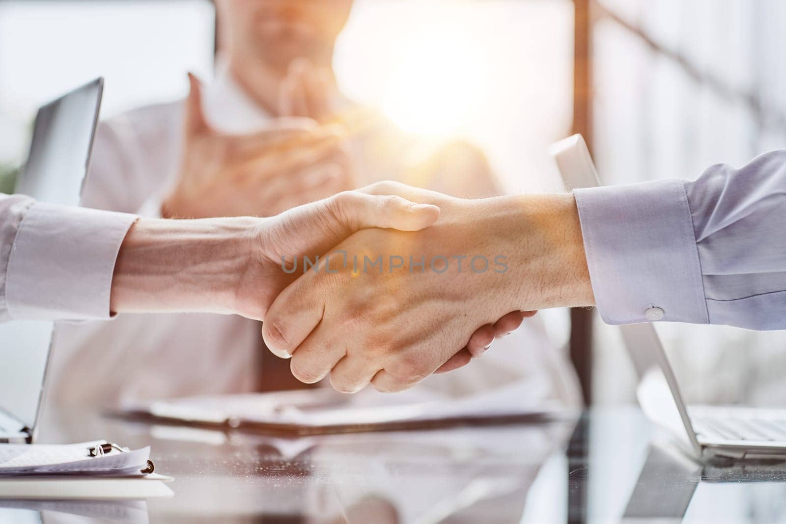 Extreme Closeup of Two Men Shaking Hands