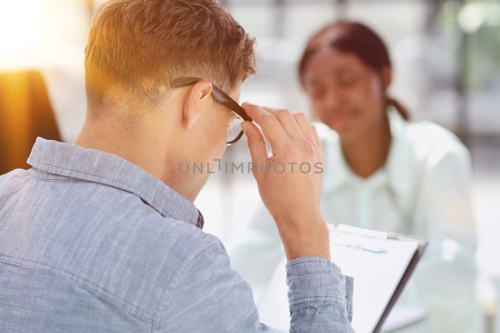 Smiling businesswoman taking interview of a job applicant