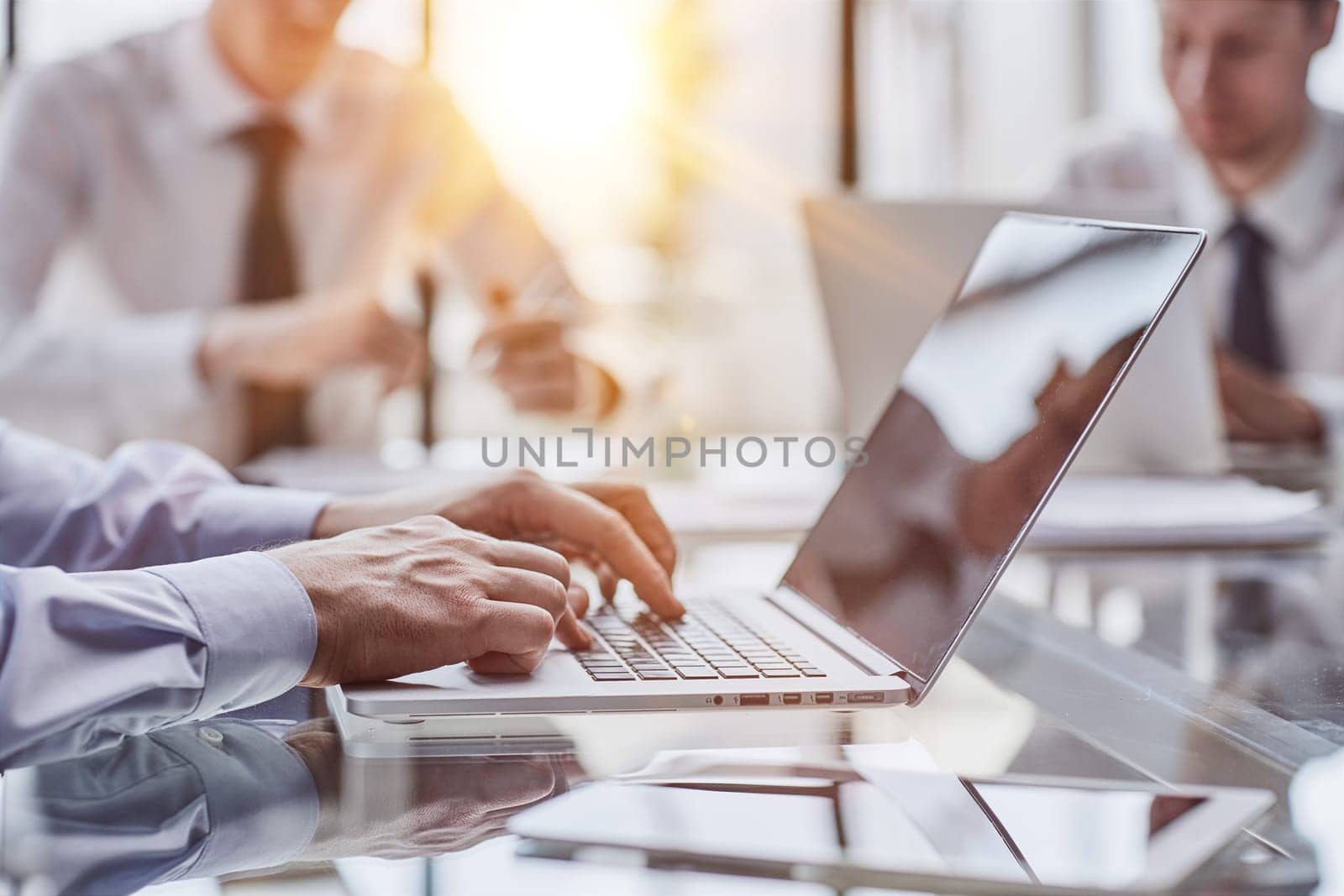 Executive hands typing on laptop at office