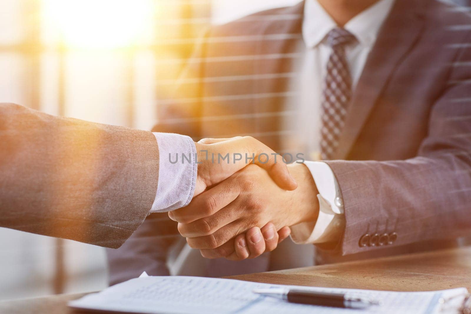 Close up of handshake in the office