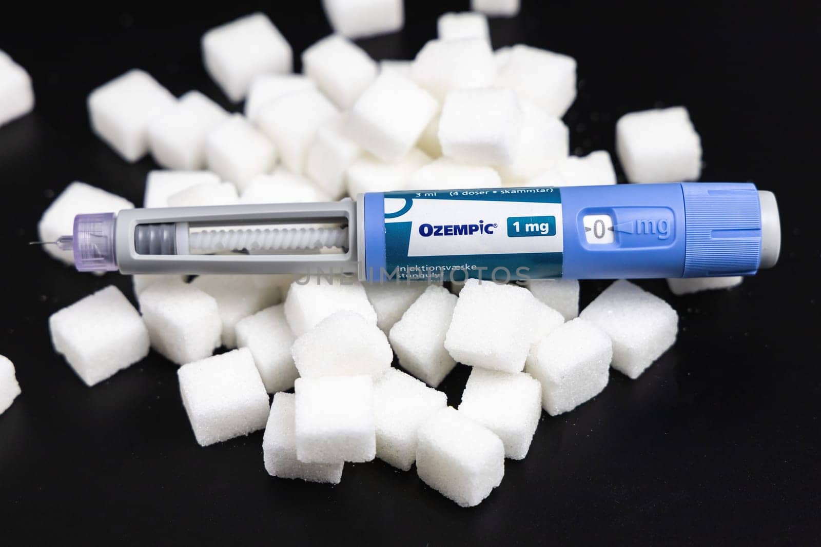 Ozempic Insulin injection pen on a dark background for diabetics and weight loss. Copenhagen, Denmark - February 16, 2025
