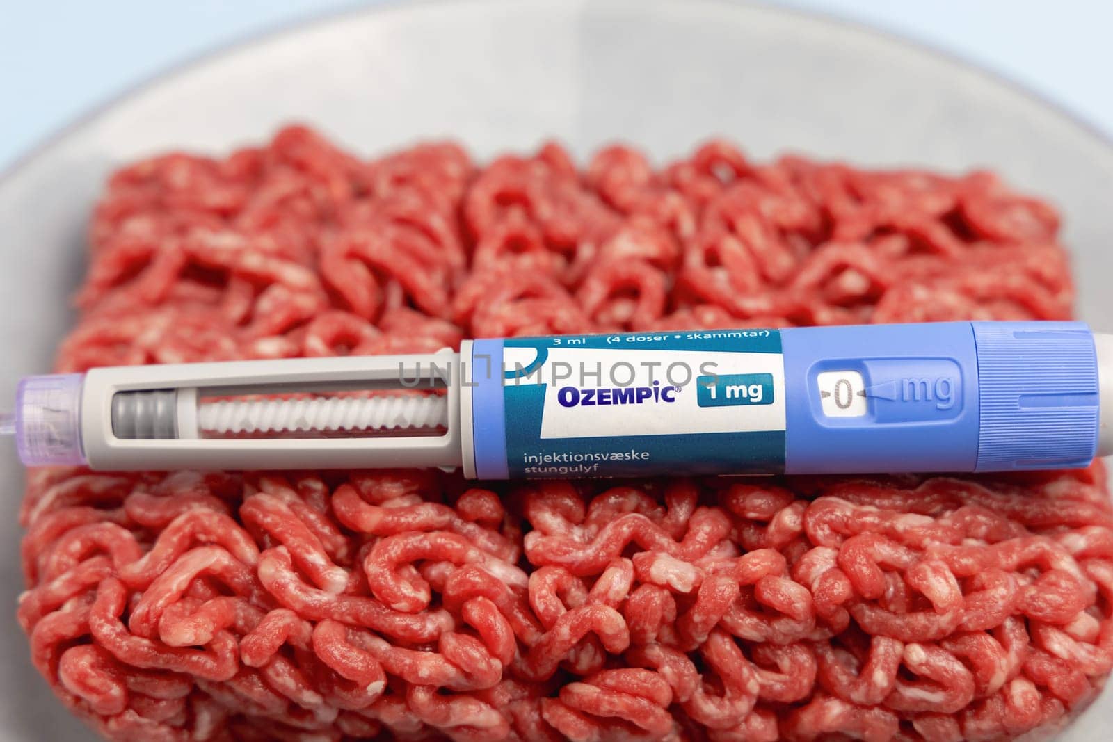 Ozempic Insulin injection pen and raw minced meat for diabetics and weight loss. Copenhagen, Denmark - February 26, 2025