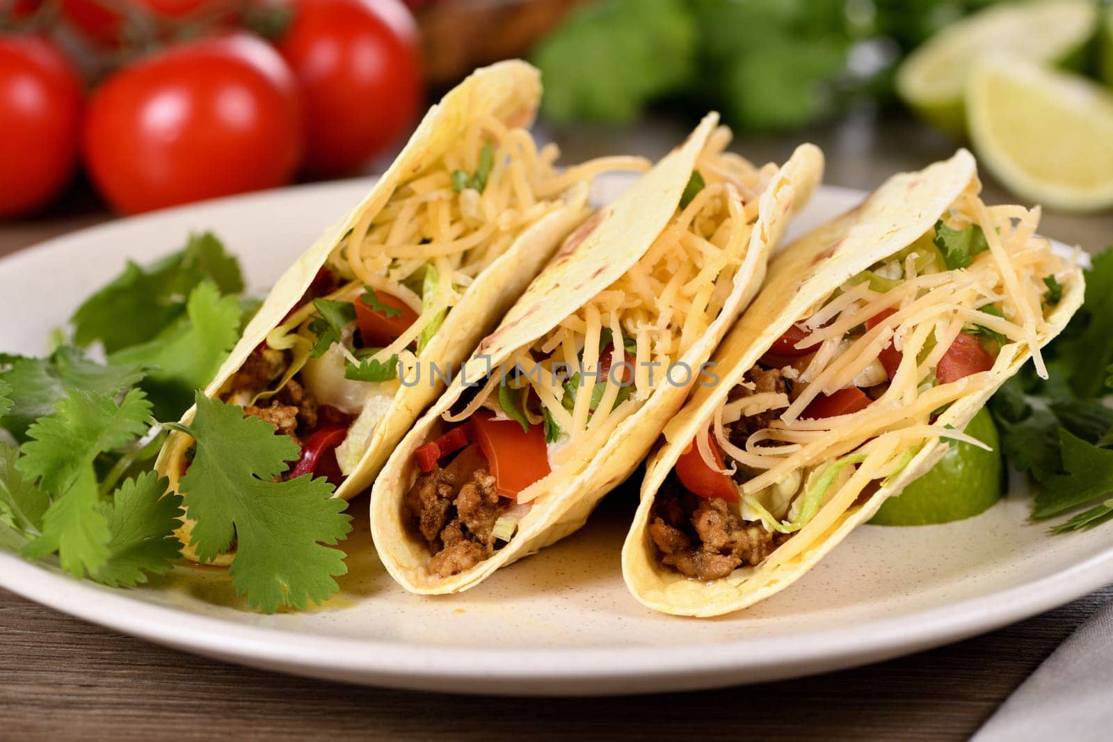 Taco with ground beef and avocado, cabbage and cheese. Mexican cuisine. 