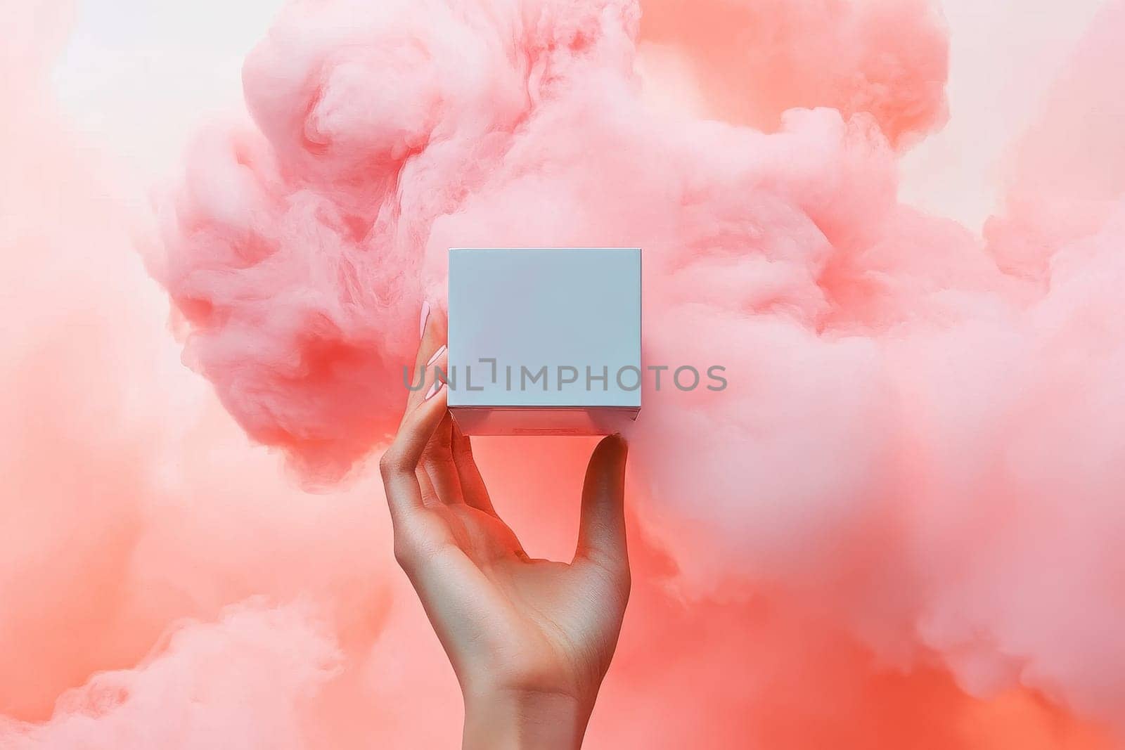 A graceful hand elegantly holds a blank cube set against a vibrant pink cloud, creating a captivating and dreamy atmosphere ideal for modern advertising.
