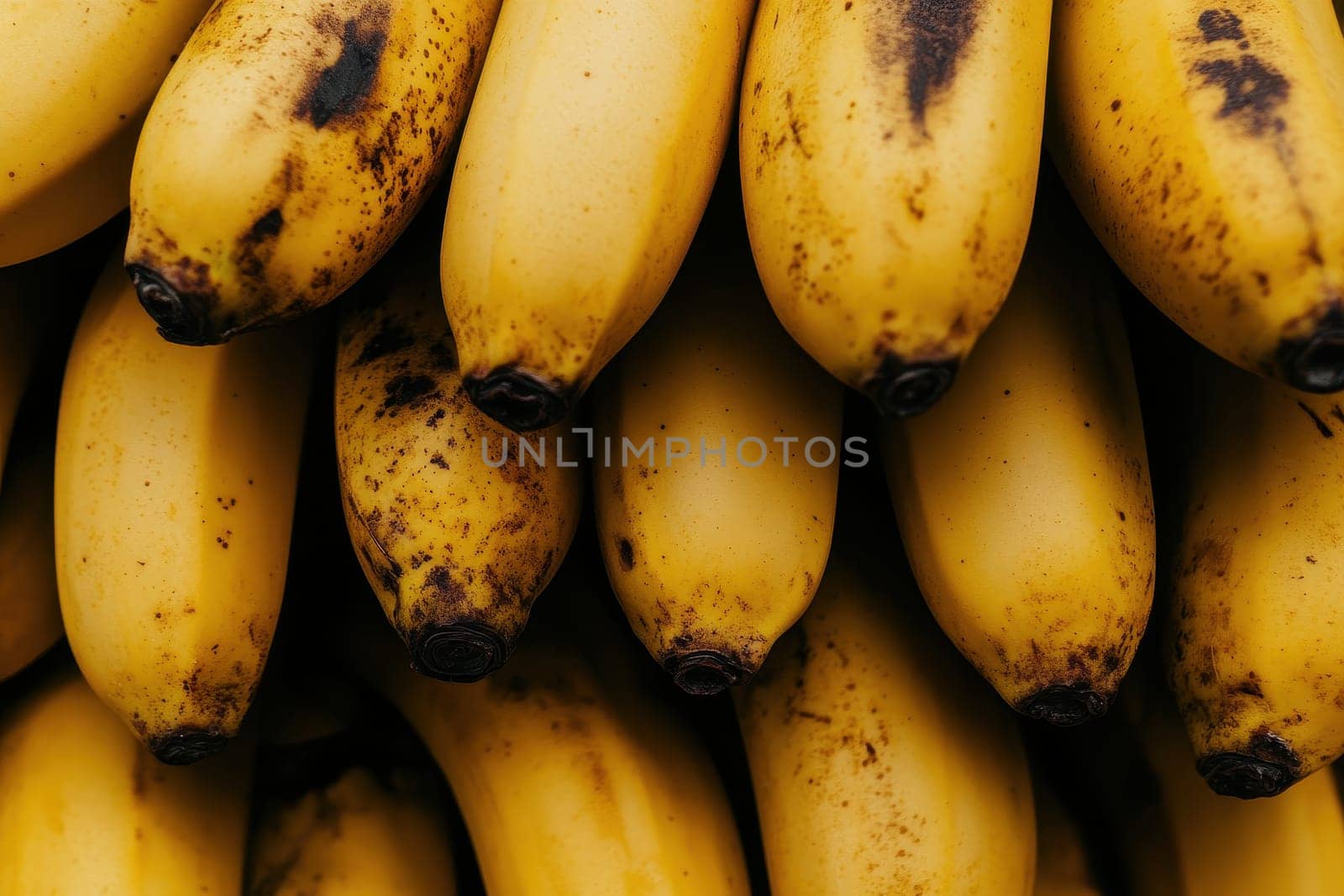 This vibrant image features a composition of bright yellow bananas stacked closely together, showcasing their rich texture and natural appeal, ideal for food-related projects.