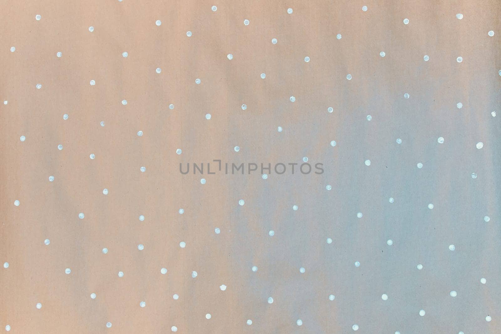 Gift wrapping paper texture. Painted paper, concept of small white dots, snowflakes.