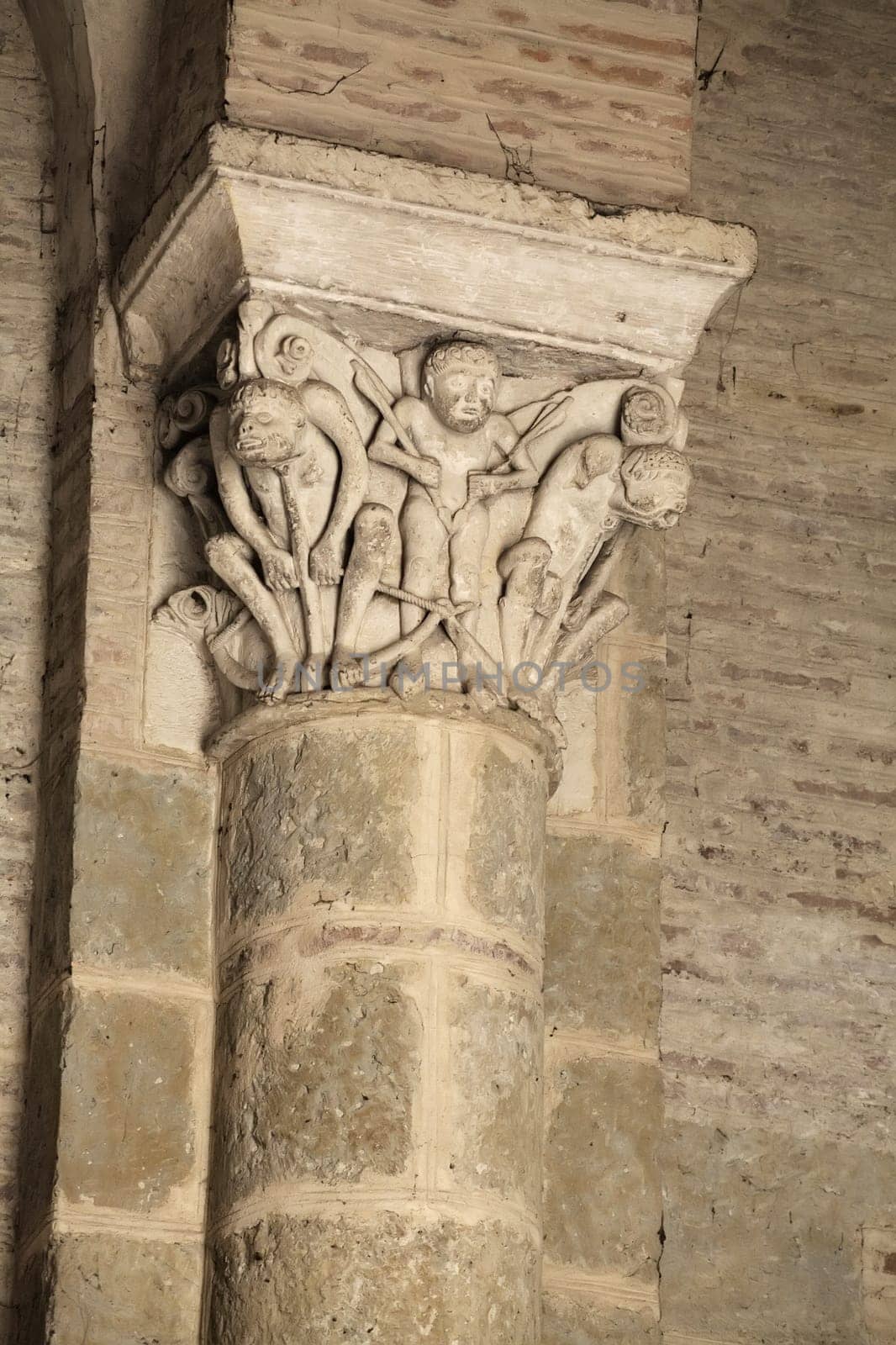 Decorative stonework highlights the rich history and artistry within Saint-Sernin basilica in Toulouse, France.