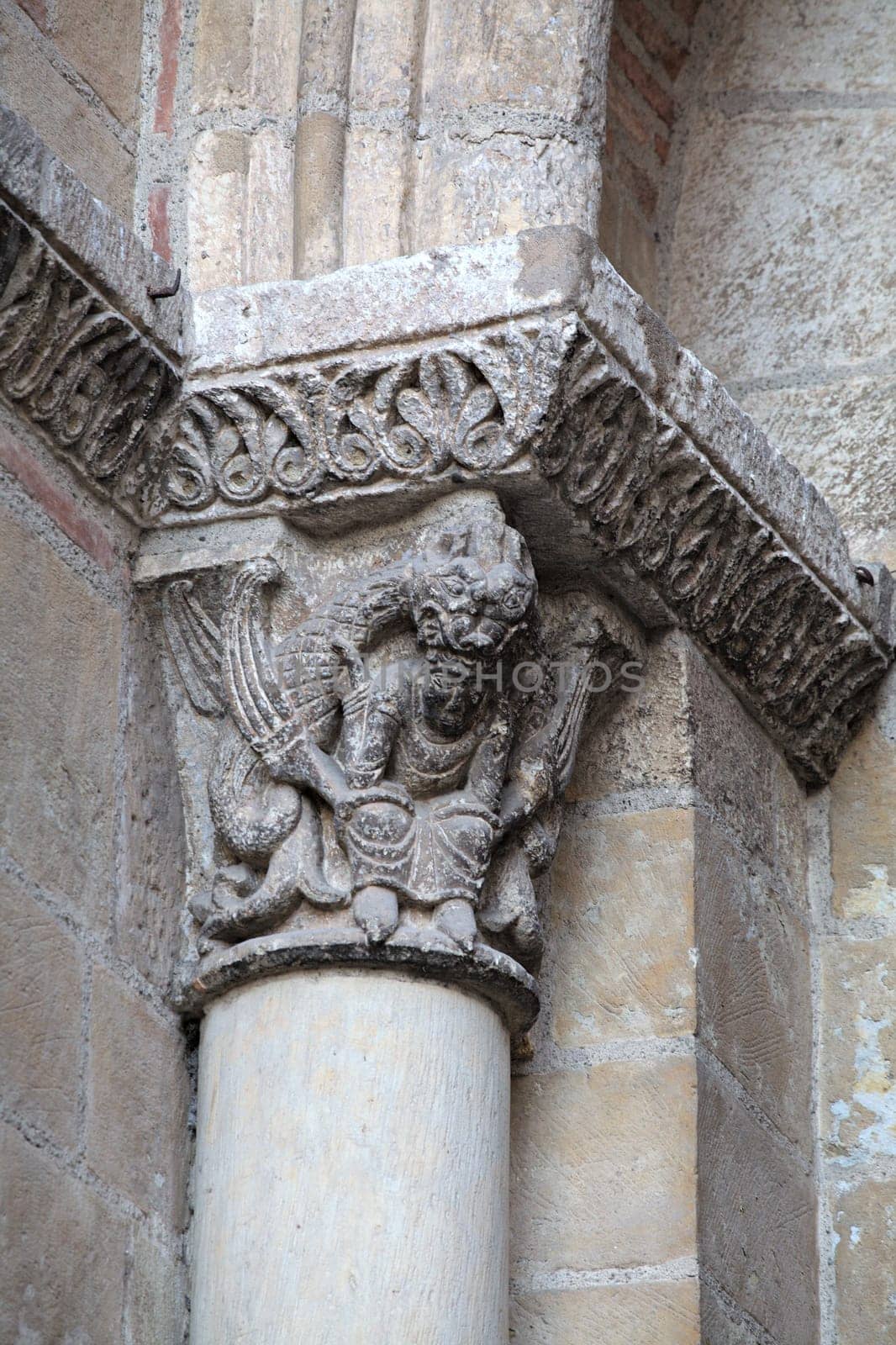 Detailed sculpture on a pillar at the Saint-Sernin basilica in Toulouse highlights artistry from the medieval period.