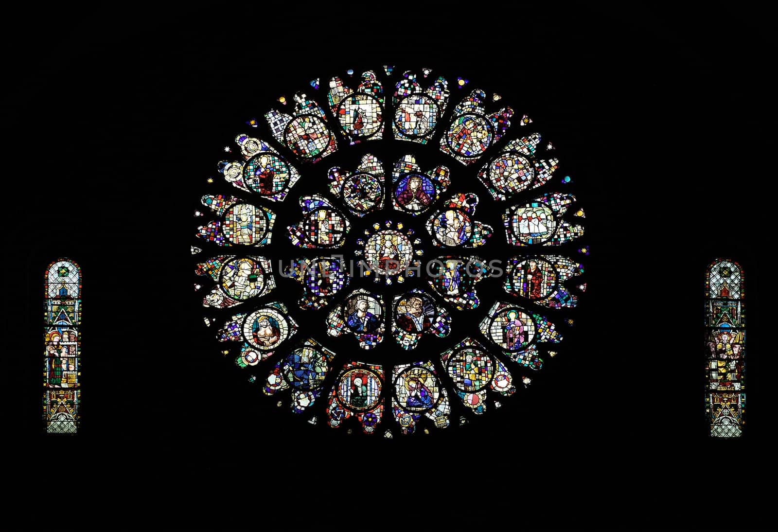 Stained glass windows illuminate Cathedral Saint-Etienne in Toulouse, showcasing its artistic heritage.