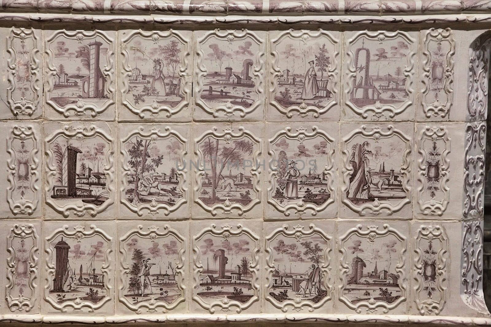 Intricate tiles depict scenes and landscapes, reflecting the essence of Chamborg castle's rich history.