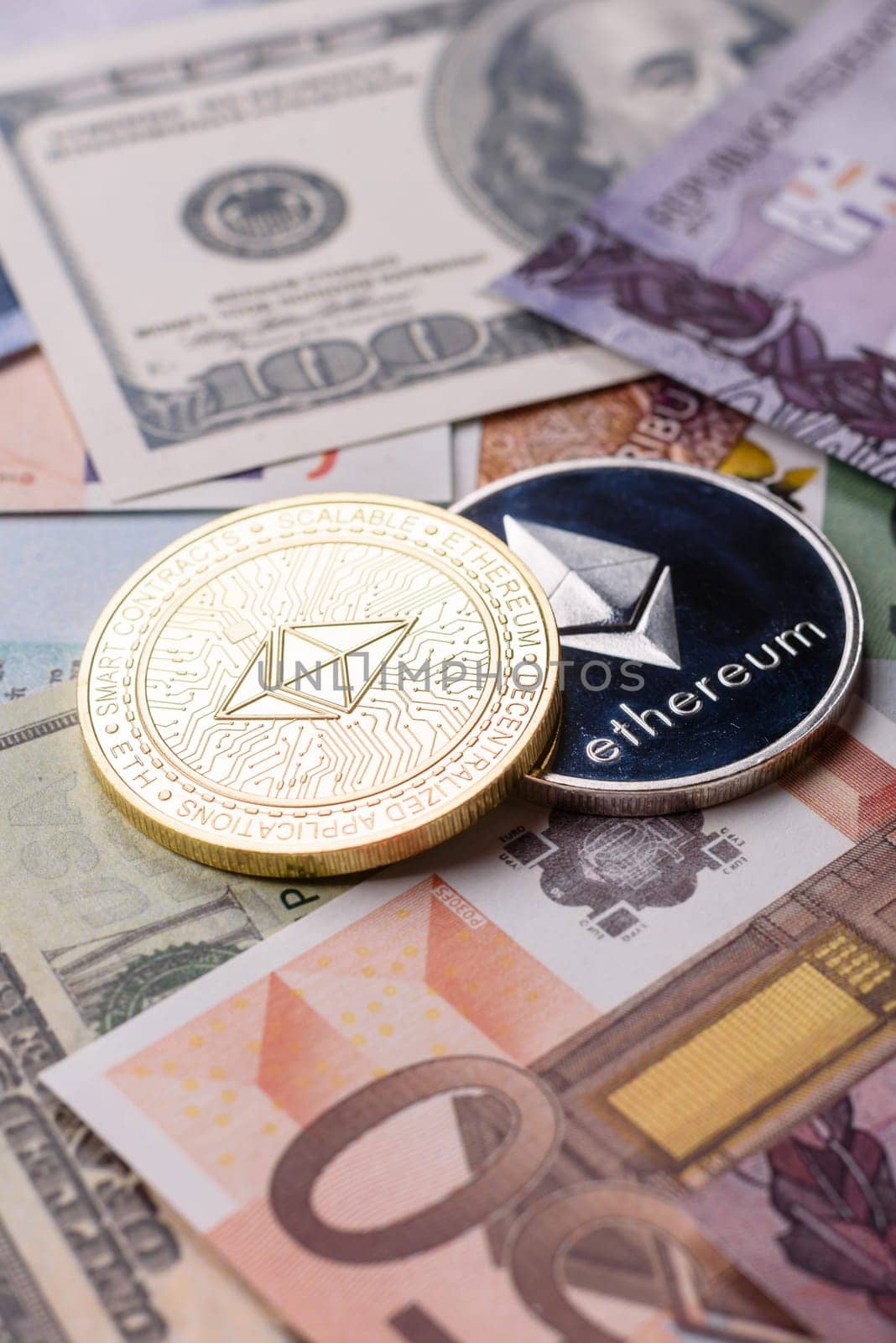 Round metal ethereum on a background of paper banknotes of different currencies. Background for your design