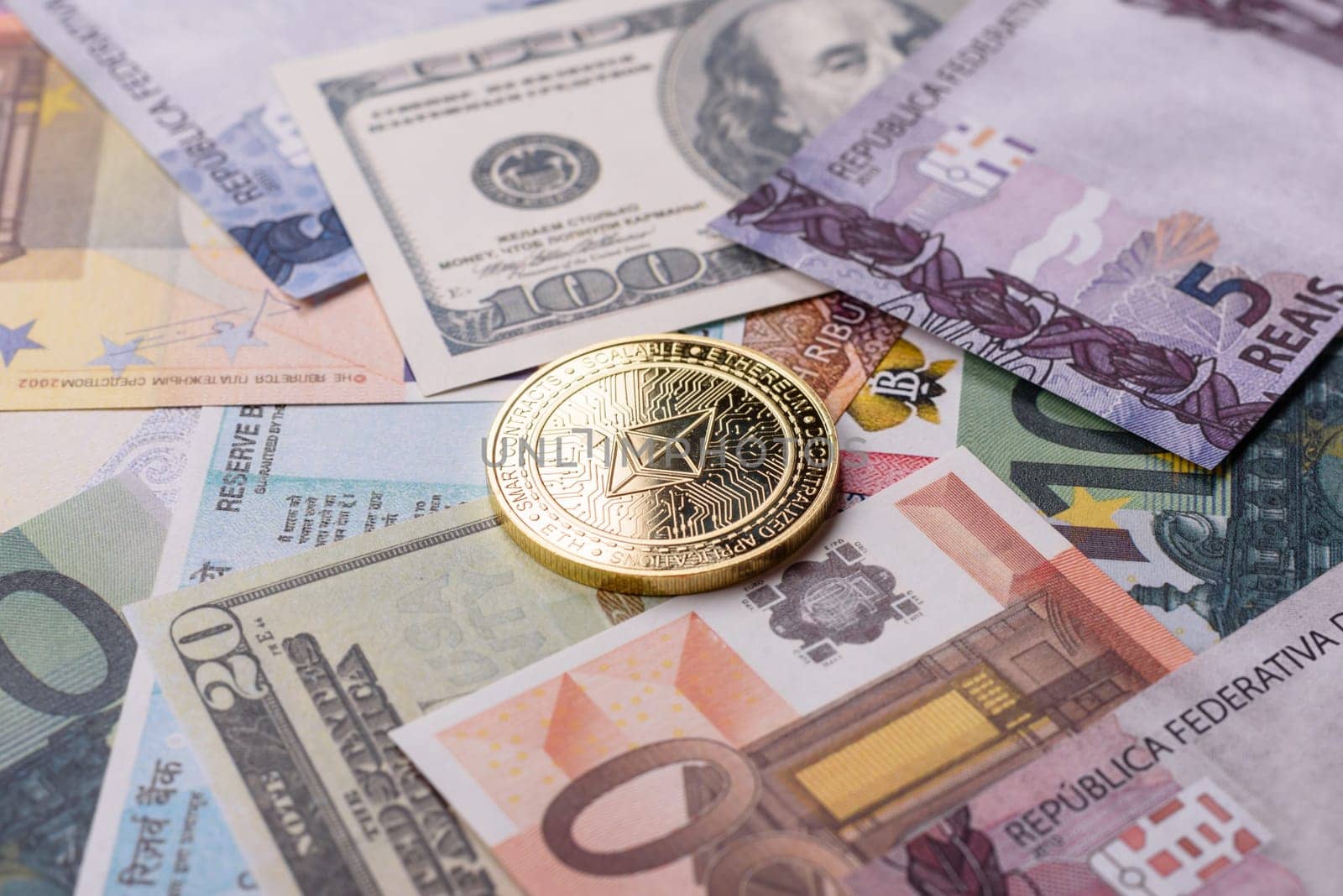 Round metal ethereum on a background of paper banknotes of different currencies. Background for your design