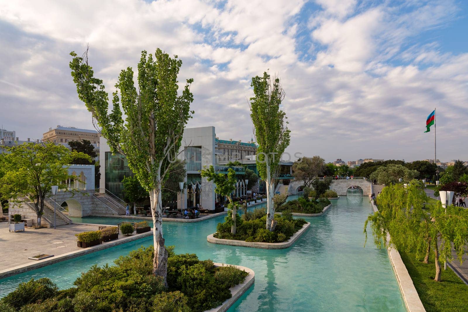 Baku, Azerbaijan - May 4, 2024: The Boulevard canals, also known as Little Venice, are surrounded by lush greenery