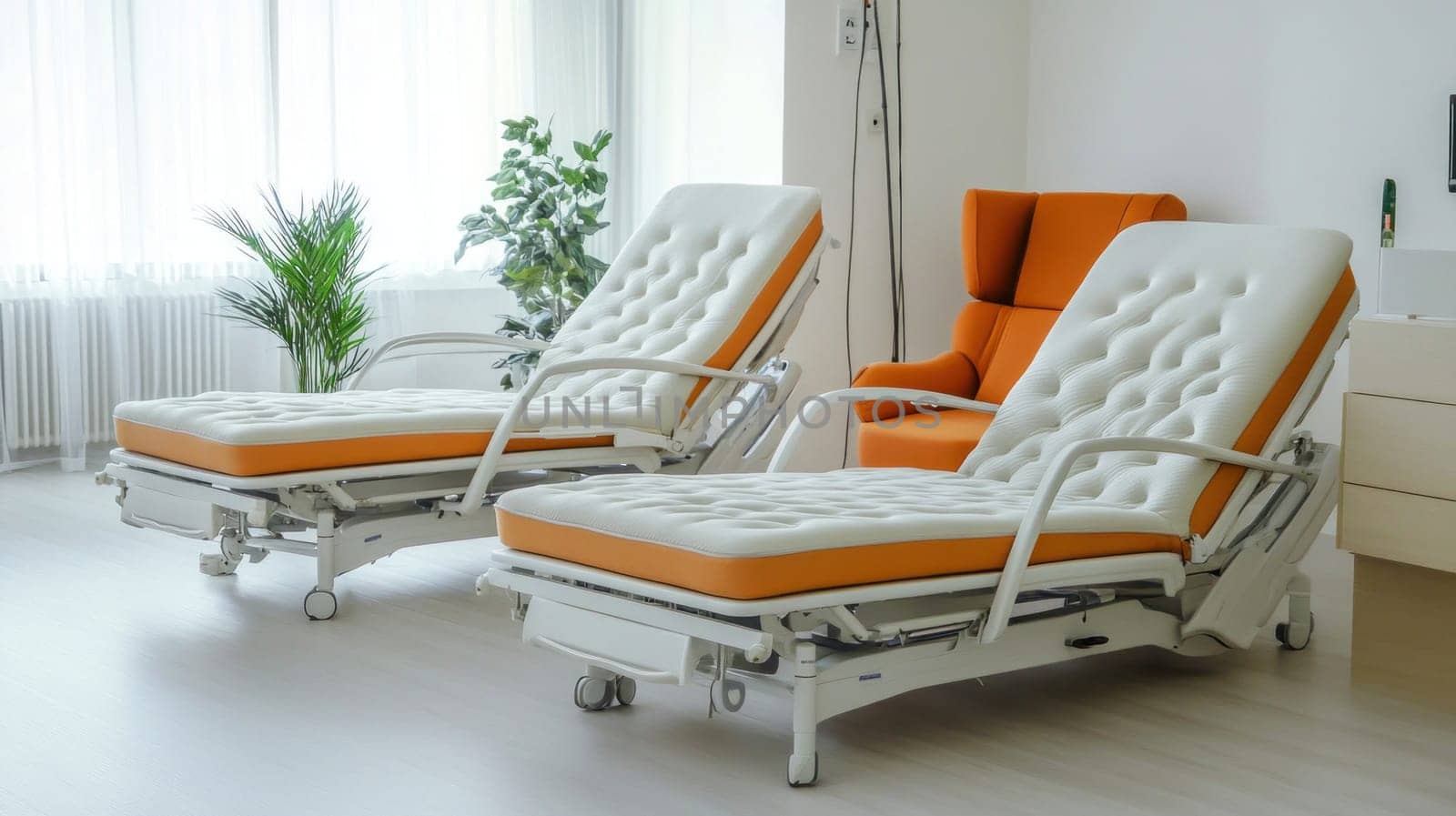 Two empty, modern, adjustable hospital beds stand ready for patients in a bright, clean room, promising comfort and care