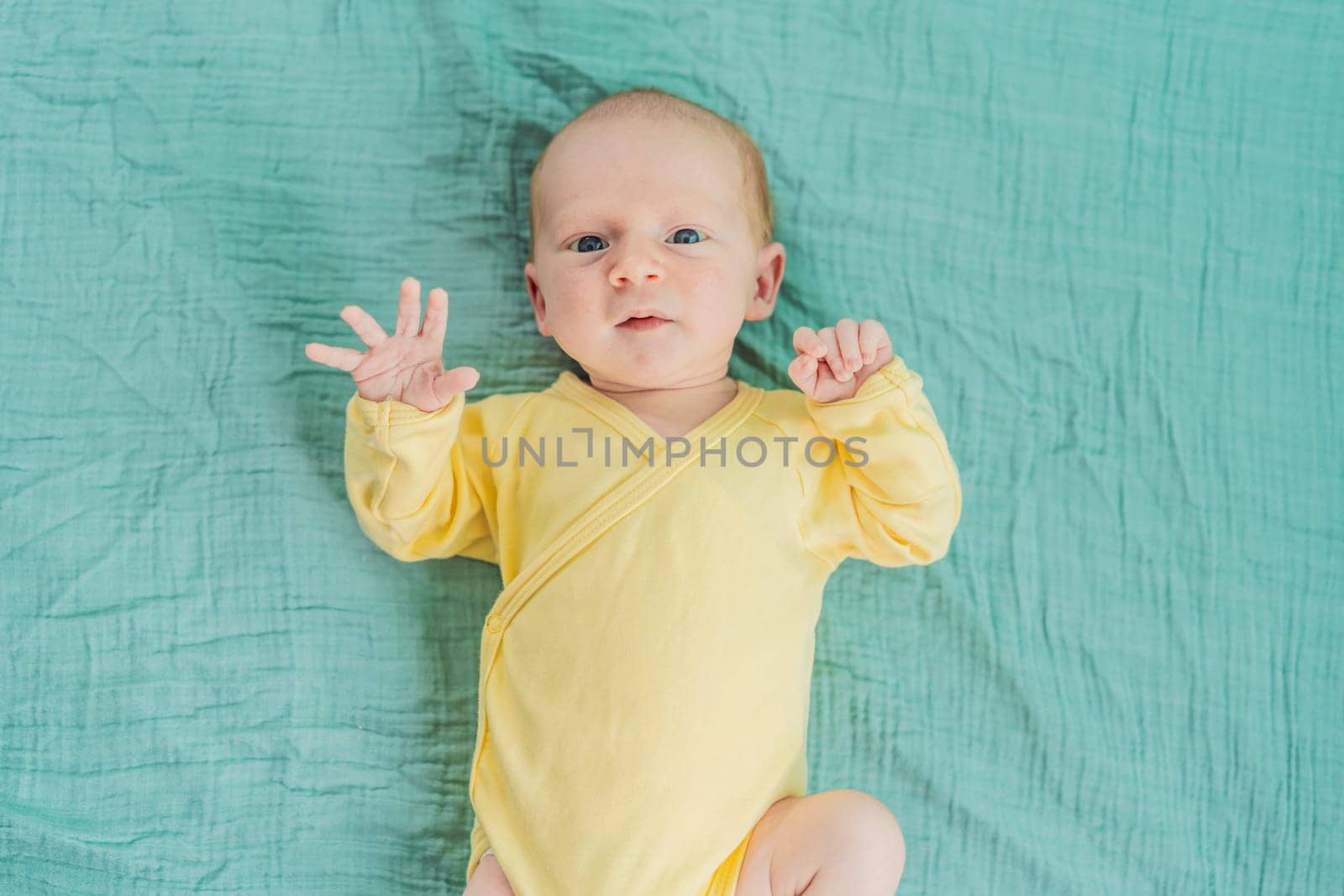 A newborn baby rests peacefully on a soft muslin swaddle, feeling comforted and secure. A tender moment of early childhood, warmth, and tranquility, symbolizing gentle care and a nurturing environment