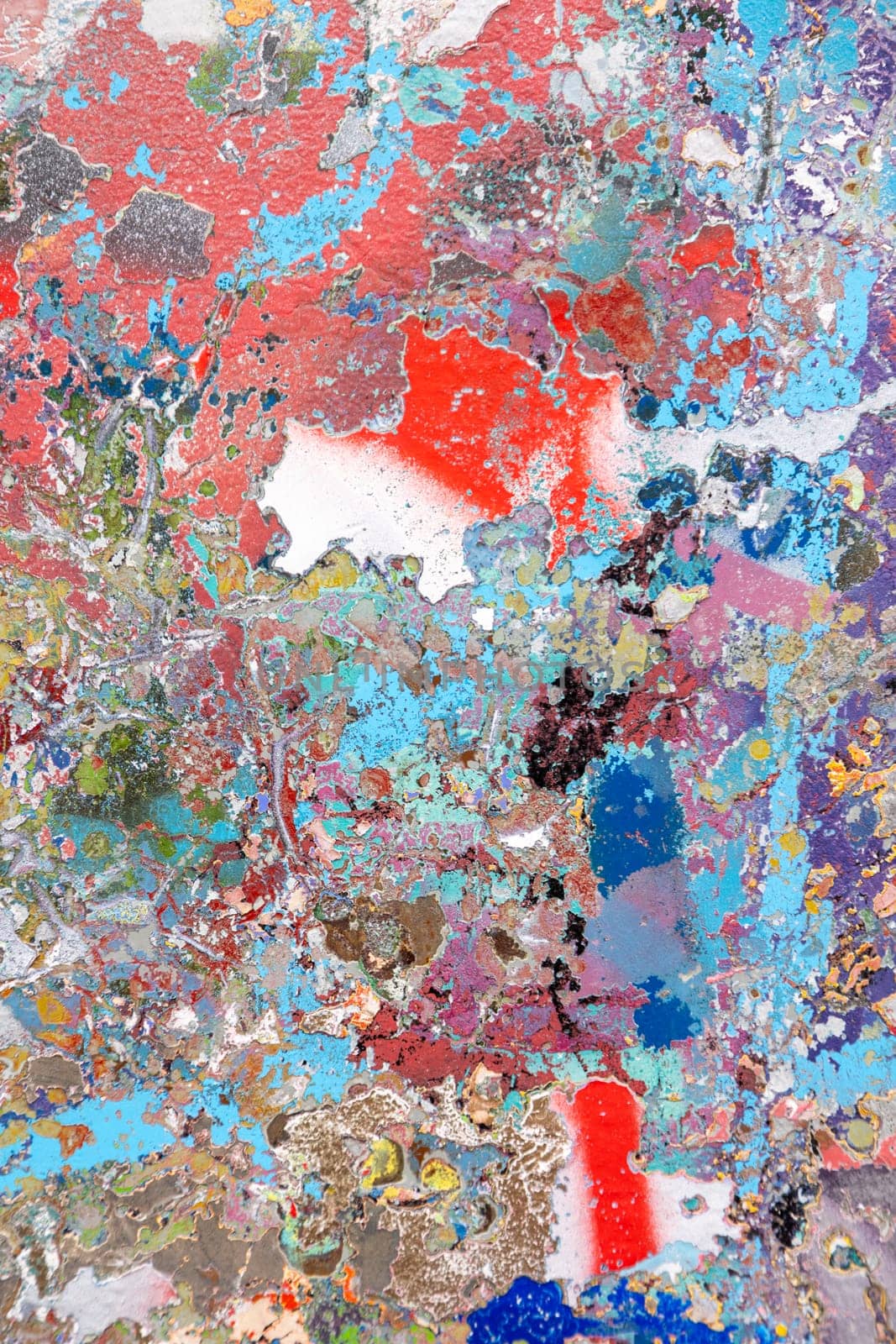 Abstract textured painting with vibrant splashes of red, blue, and gold. A visually rich composition ideal for backgrounds, digital art, and creative projects