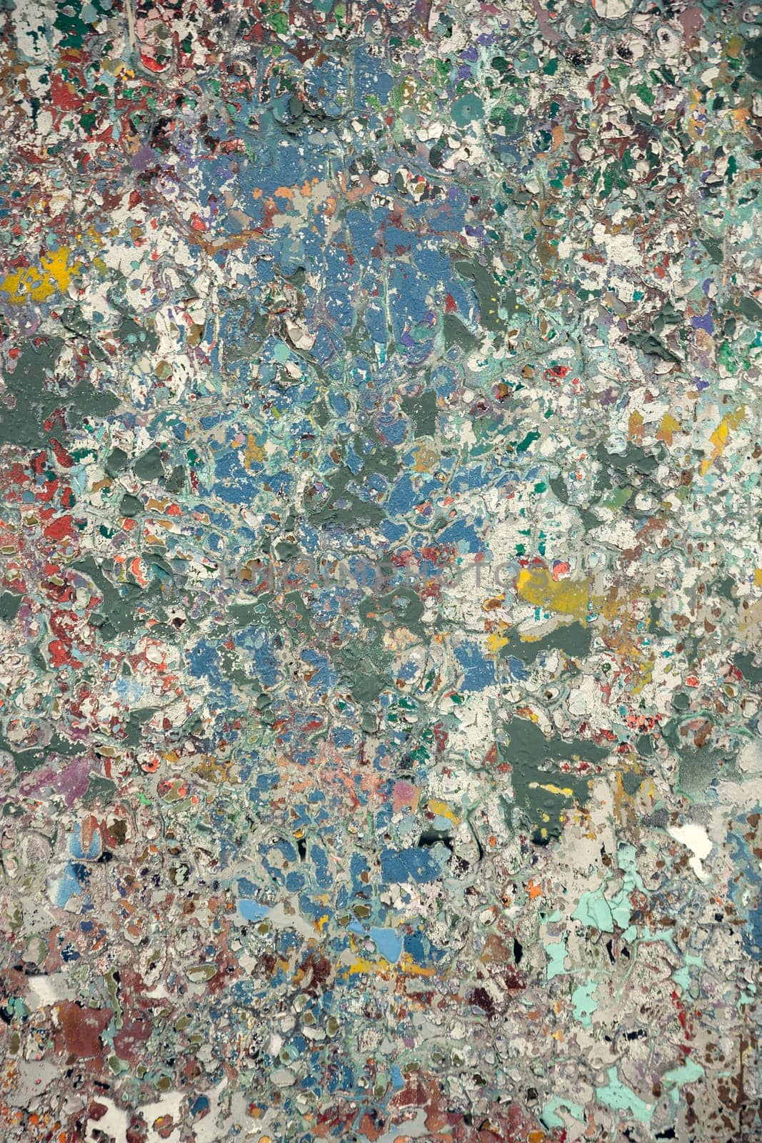Vibrant abstract texture showcasing layers of cracked and peeling paint in shades of blue, green, and earthy hues. A perfect artistic background for digital design and creative projects.