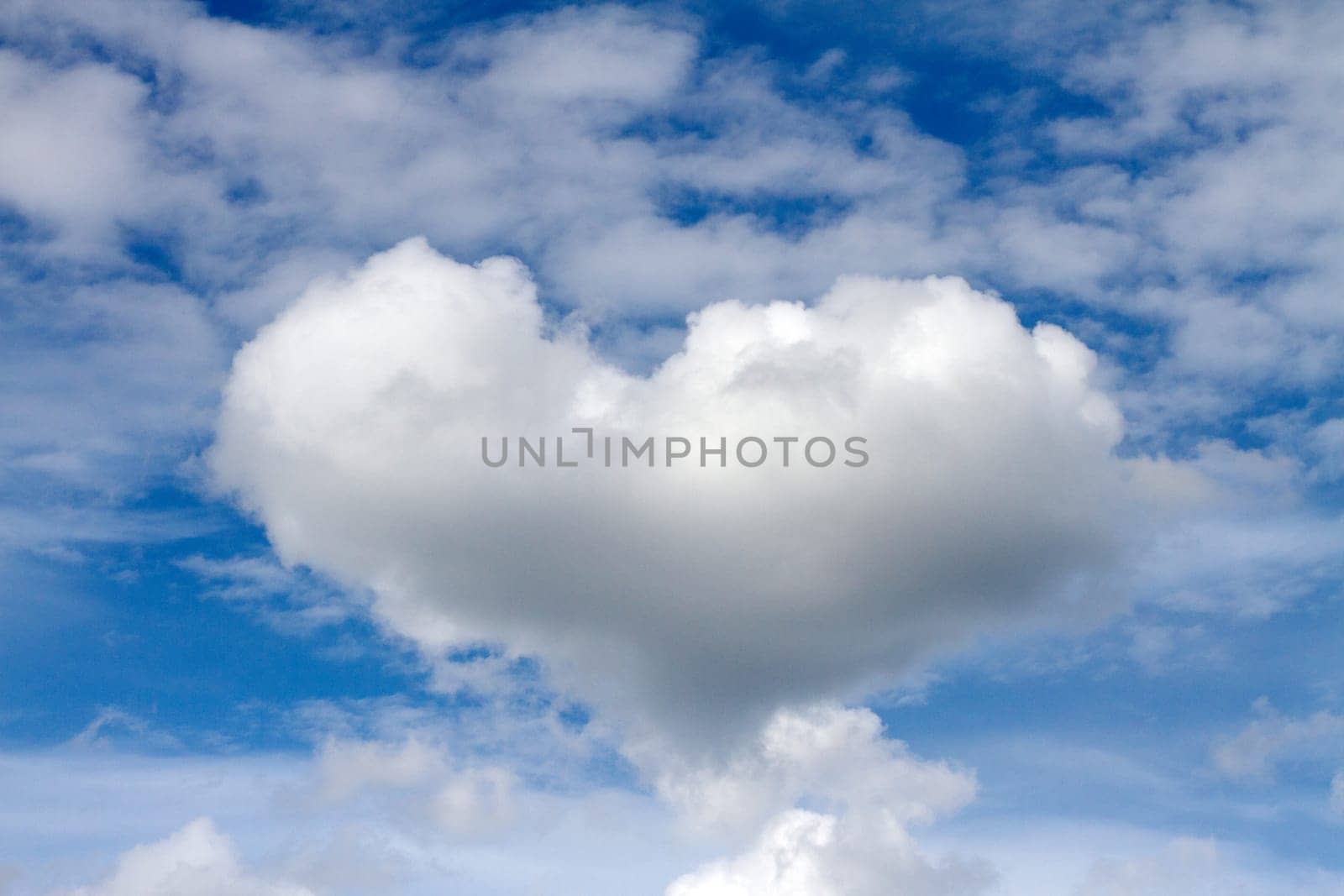 heart shaped cloud flies beautifully across the sky, love and care