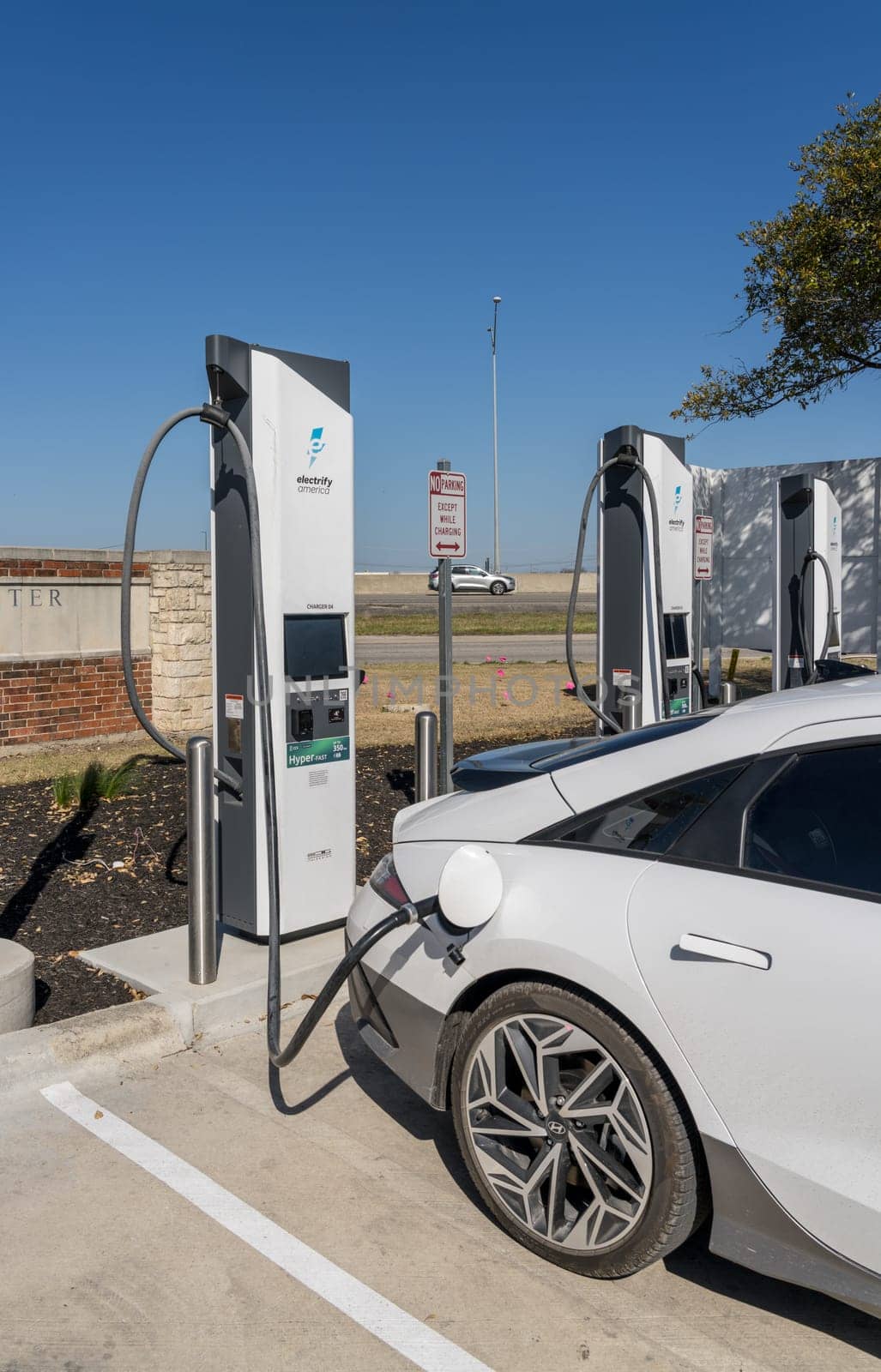 New Braunfels, TX - 1 March 2025: Hyundai Ioniq 6 being charged at Electrify America Hyperfast 350KW charging station in Texas