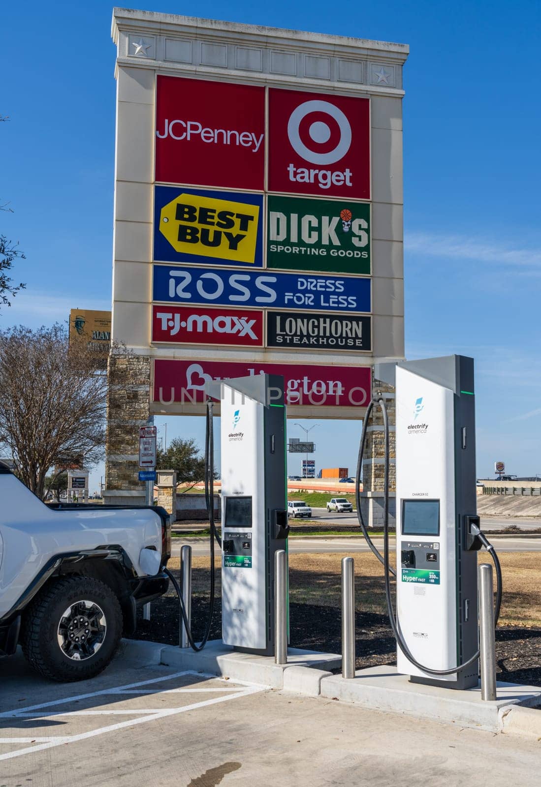 New Braunfels, TX - 1 March 2025: Hummer SUV truck being charged at Electrify America Hyperfast 350KW charging station in Texas