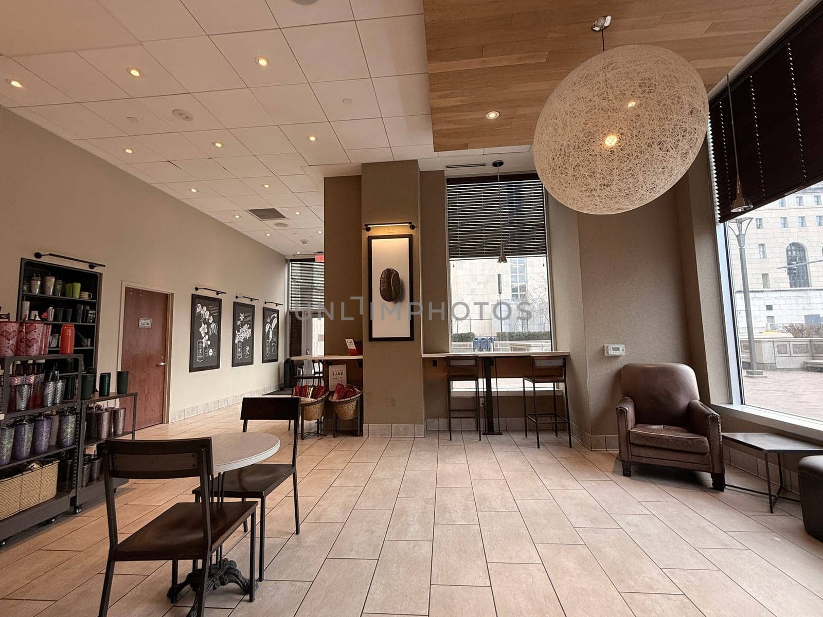 cozy cafe interior featuring stylish furniture, subdued lighting, and a warm, welcoming ambiance ideal for relaxation, conversation, and enjoying a cup of coffee or tea, good for multimedia content creation