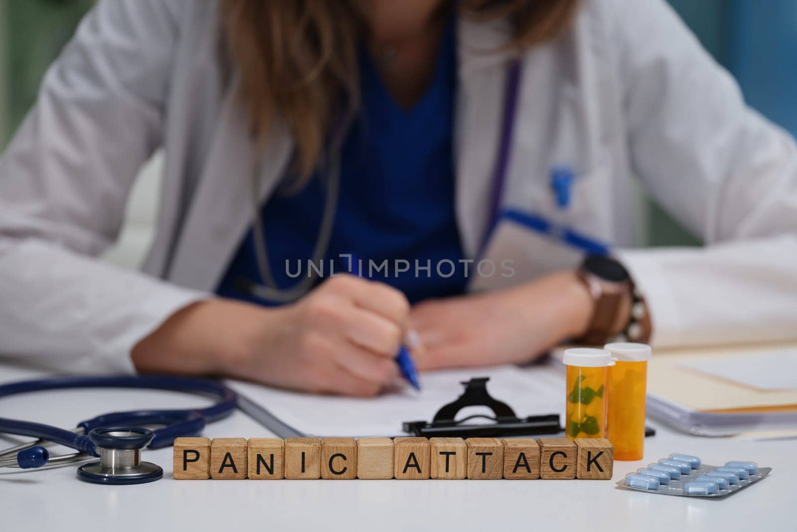 A doctor records observations on panic attacks, emphasizing the significance of mental health awareness and education
