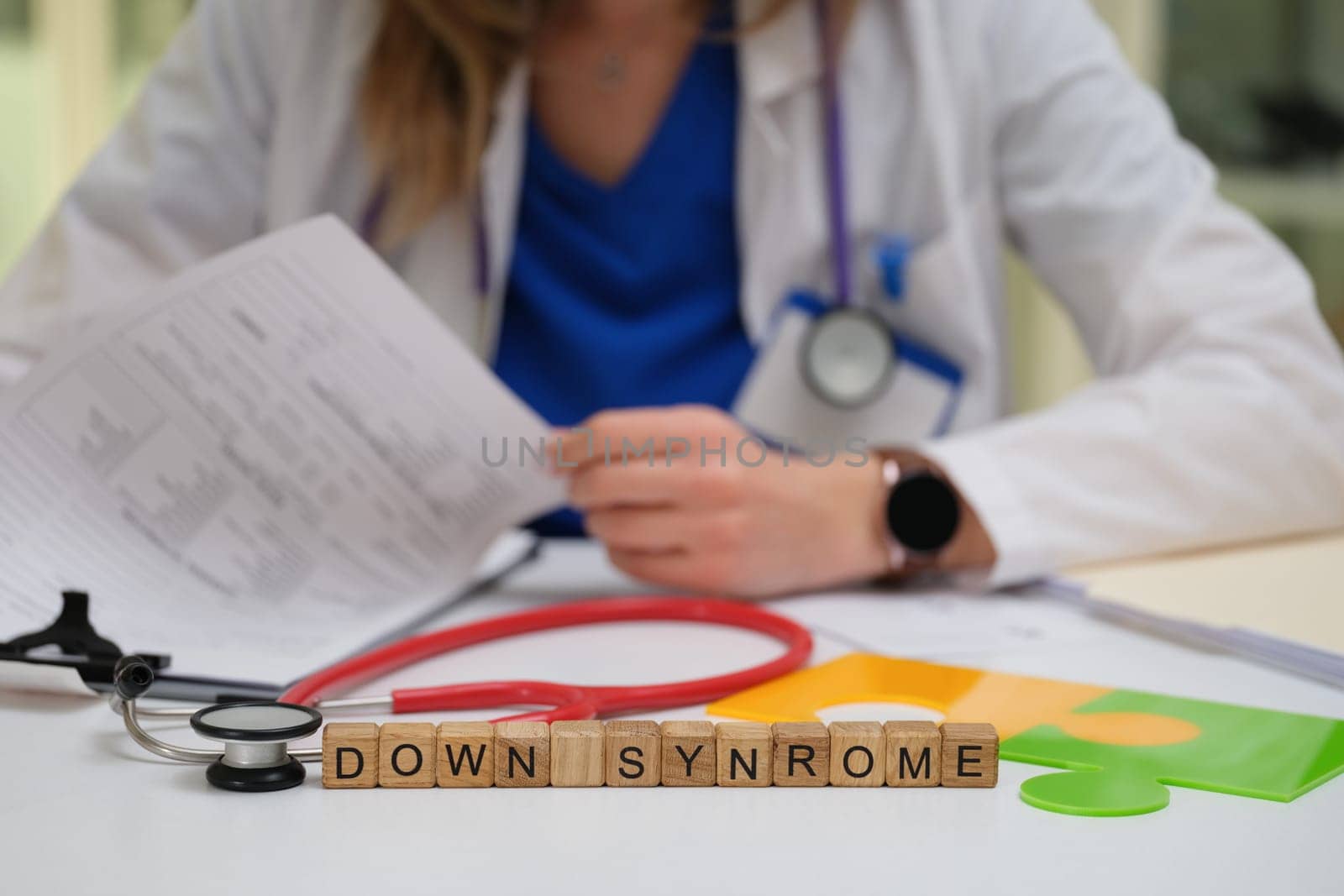A qualified healthcare professional carefully reviews important documents related to Down Syndrome and its effects