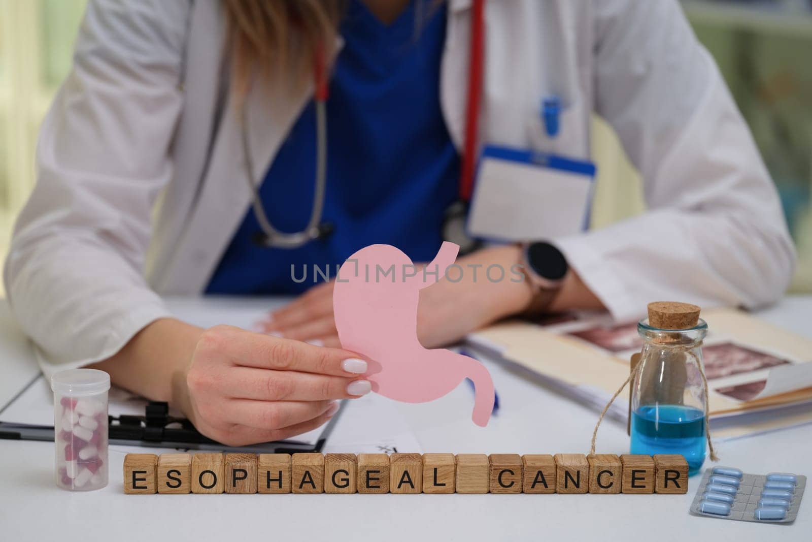 A dedicated healthcare professional actively raises awareness about esophageal cancer using various educational tools