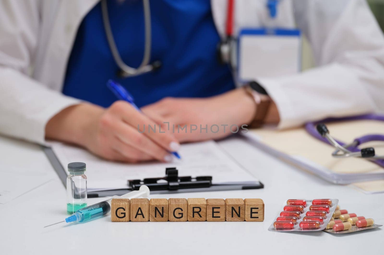 A healthcare professional meticulously documents findings on gangrene while having medical supplies placed nearby