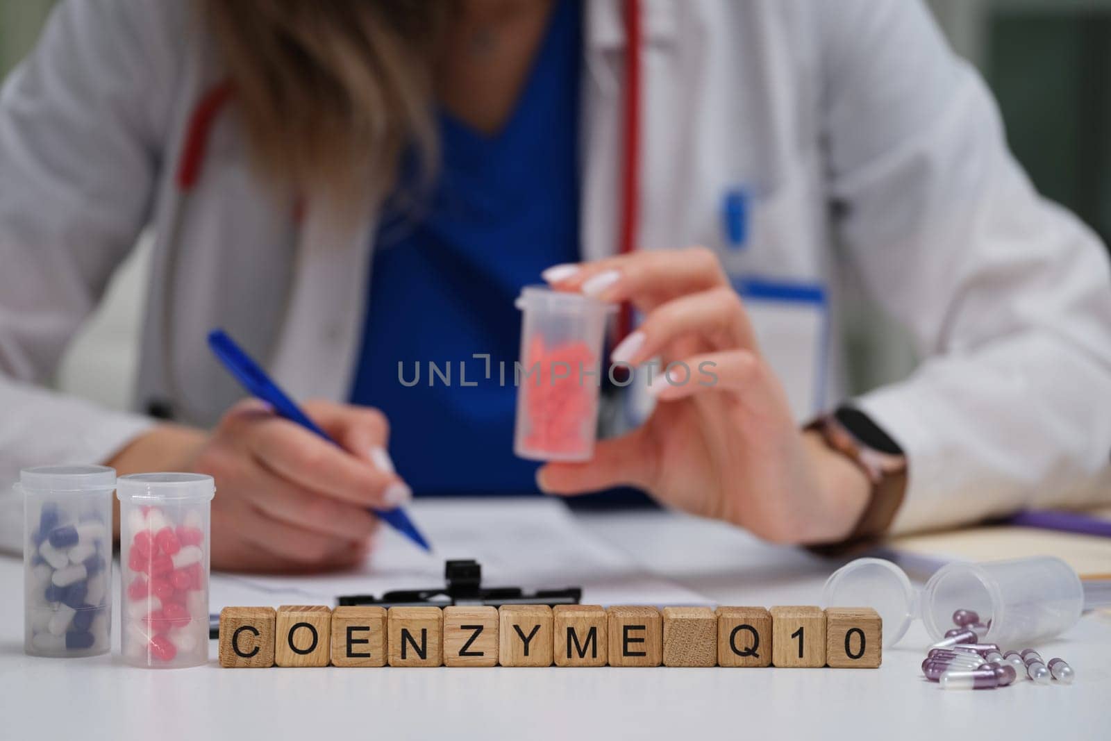 A qualified healthcare professional thoroughly examines Coenzyme Q10 dietary supplements for a patient