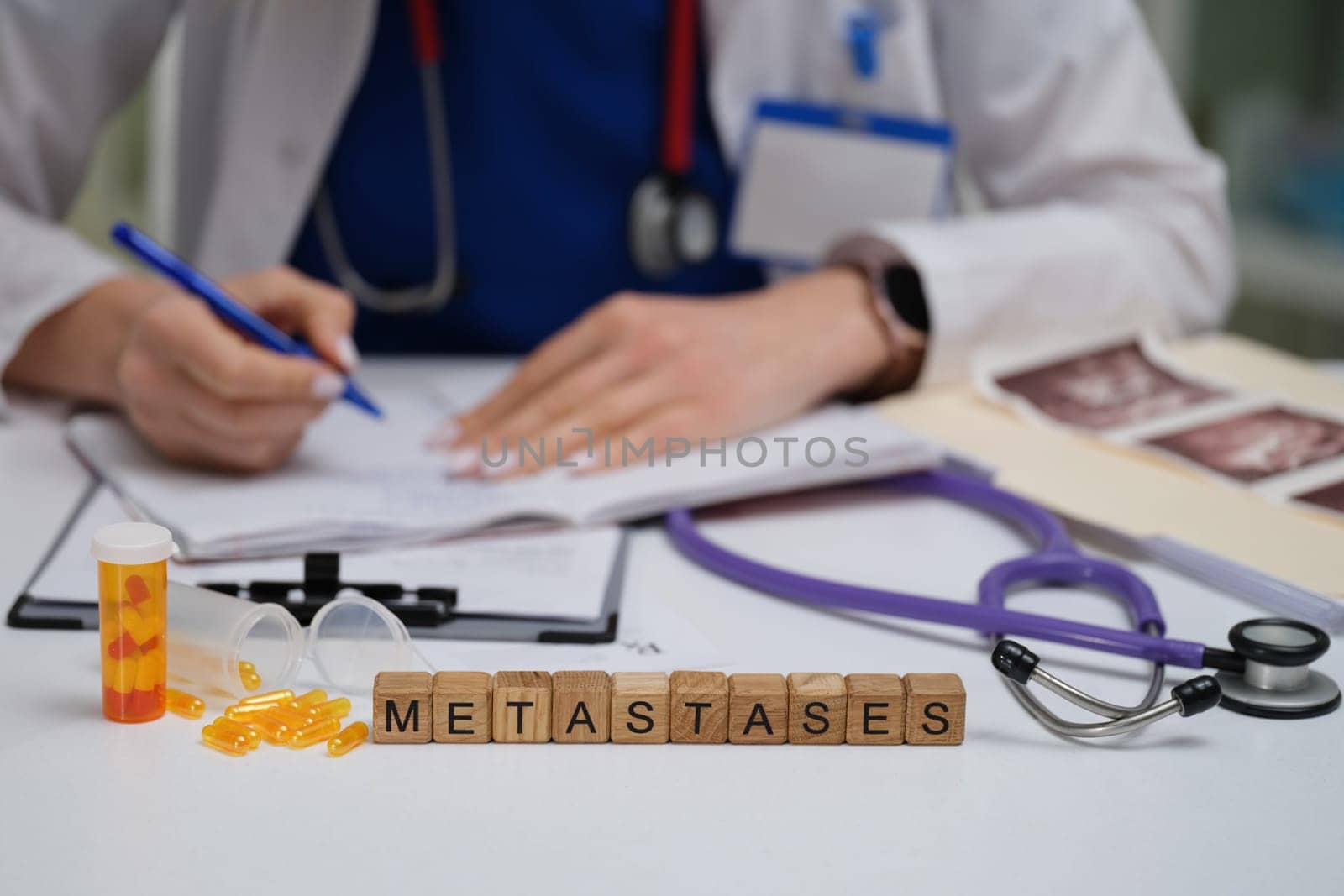 In a clinical setting, a doctor thoroughly examines metastases along with the patients medical records