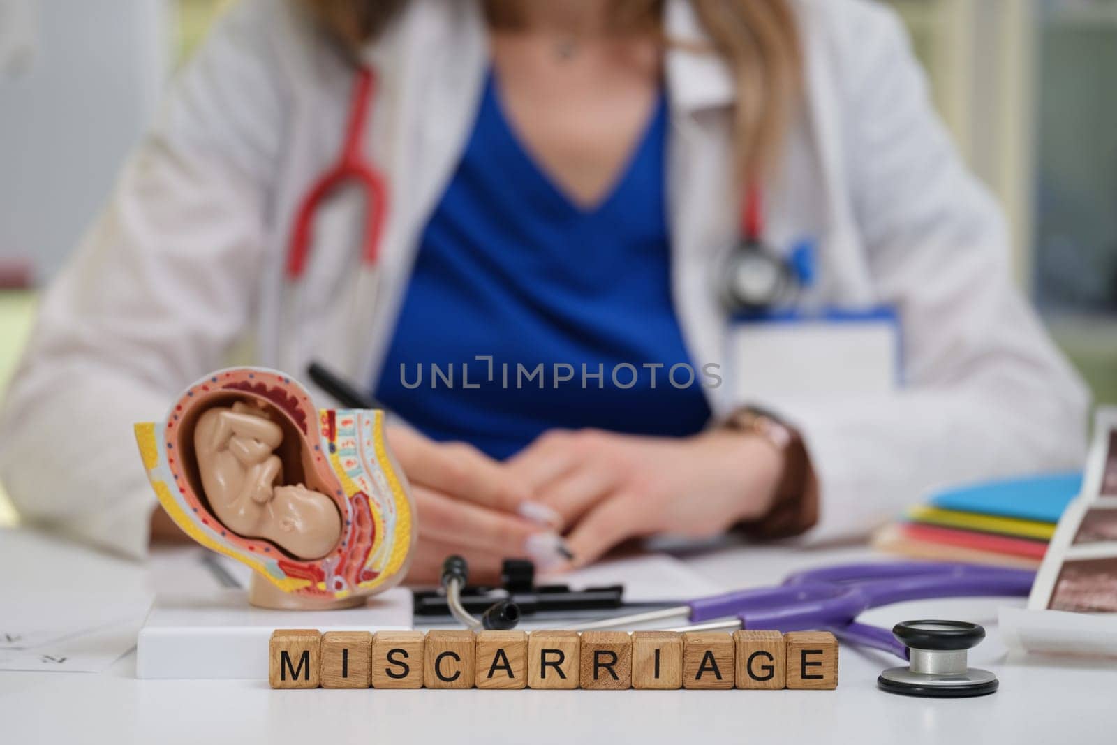 A healthcare professional is thoroughly examining various topics related to miscarriage and fetal health issues