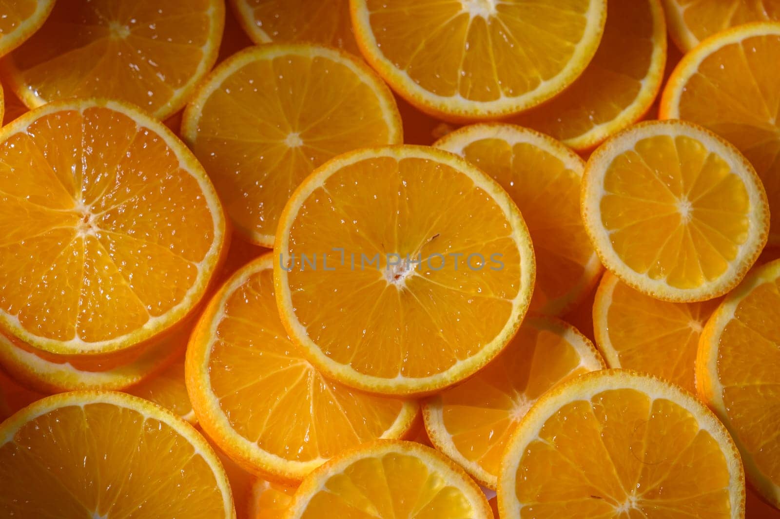 Juicy orange slices are perfectly displayed, showcasing their vibrant color and inviting aroma for all to enjoy.