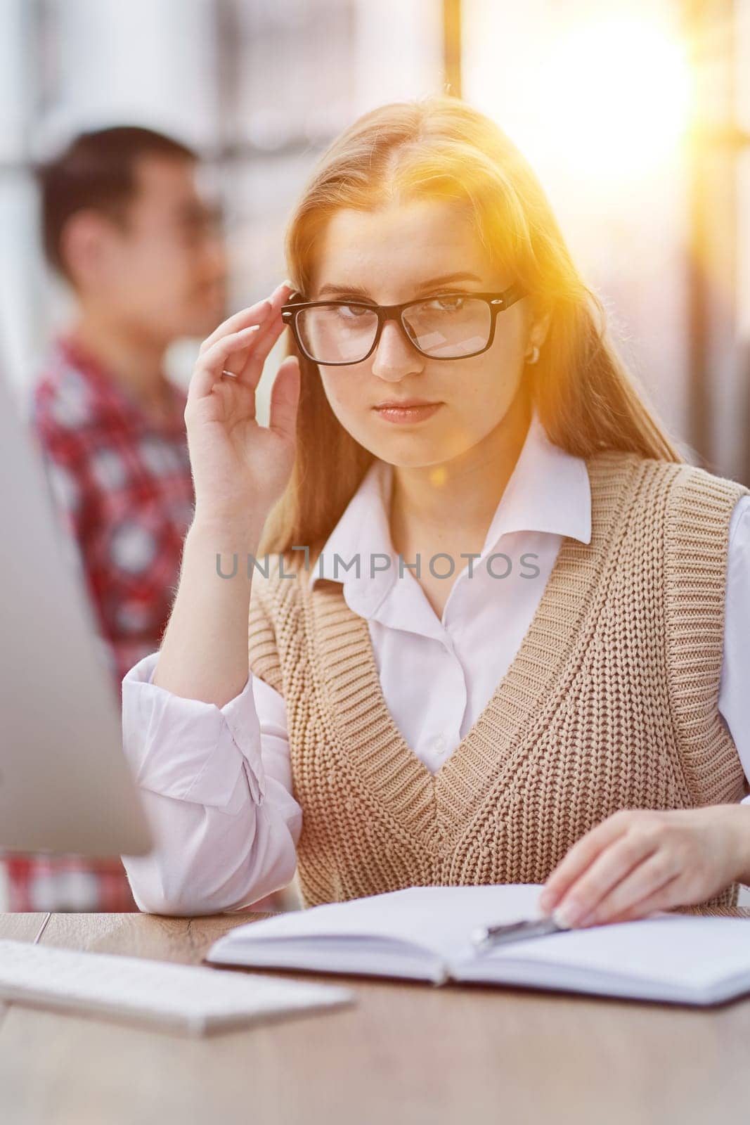 Woman hand writing in an agenda at home