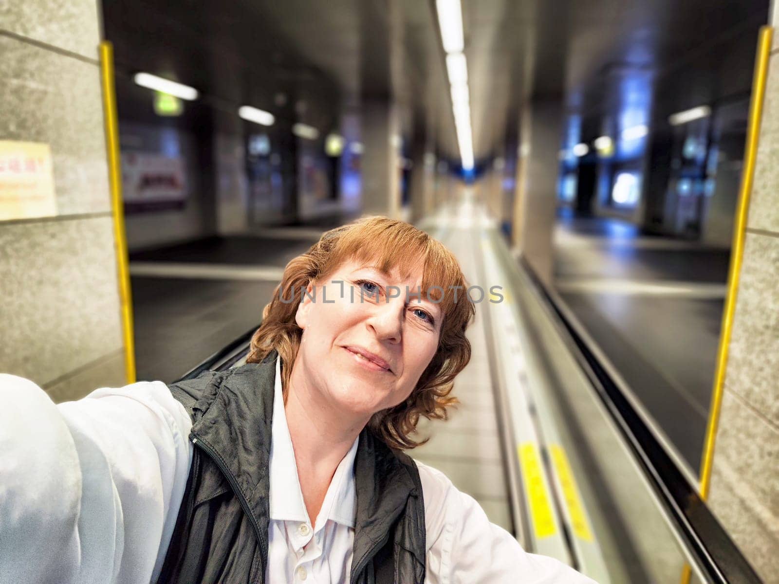 A traveler enjoys a moment in the subway of Macau, filled with anticipation for the city's attractions.
