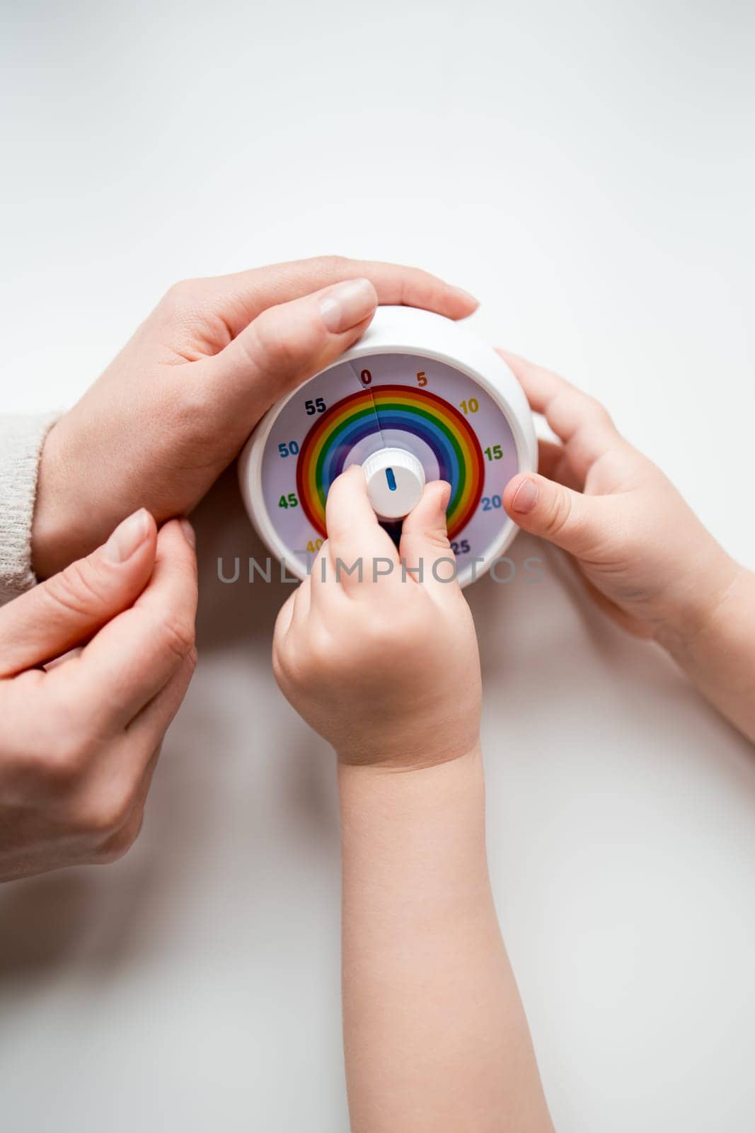Adult and child interaction with circular temperature control device.