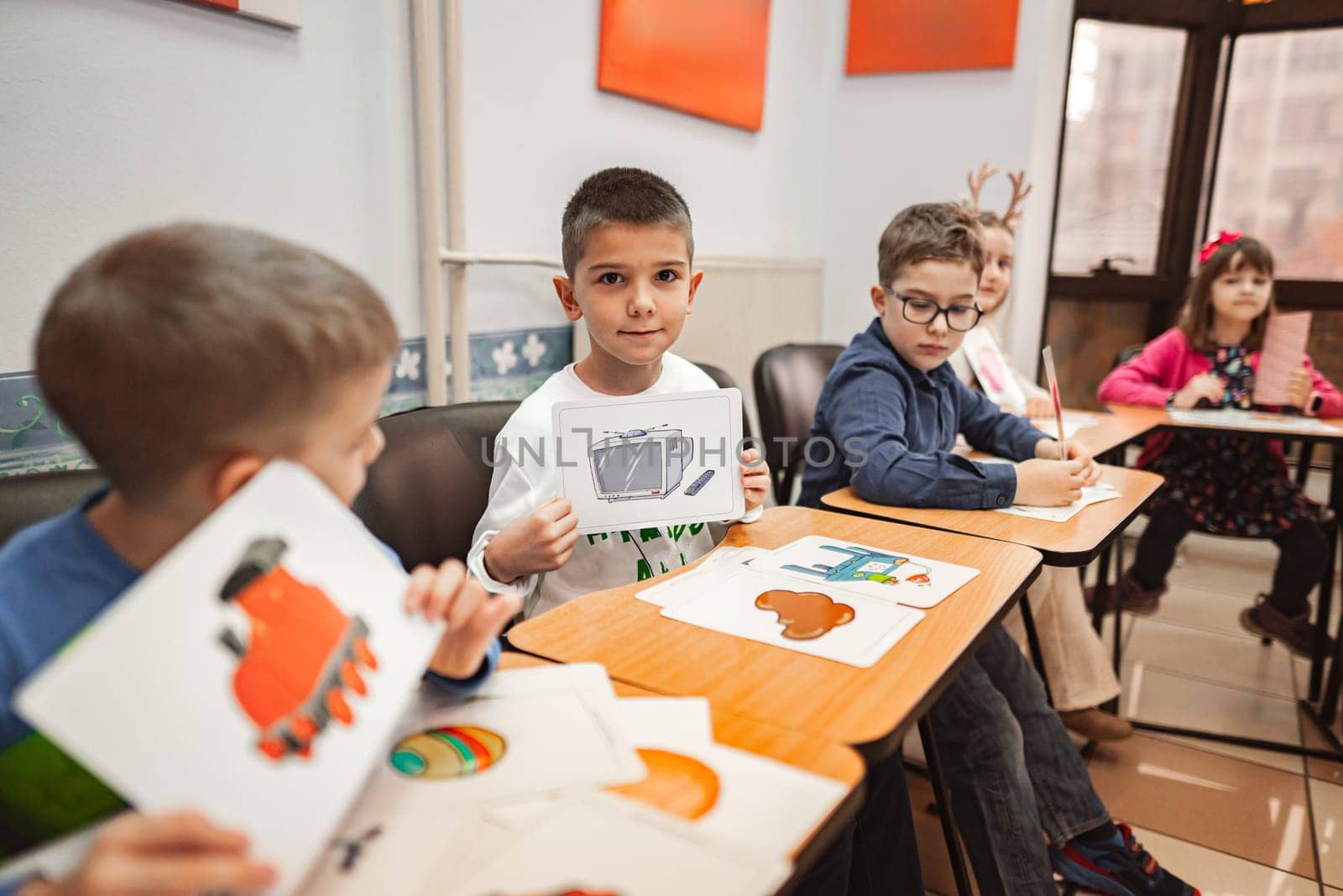 Group of elementary students learning together at language school.