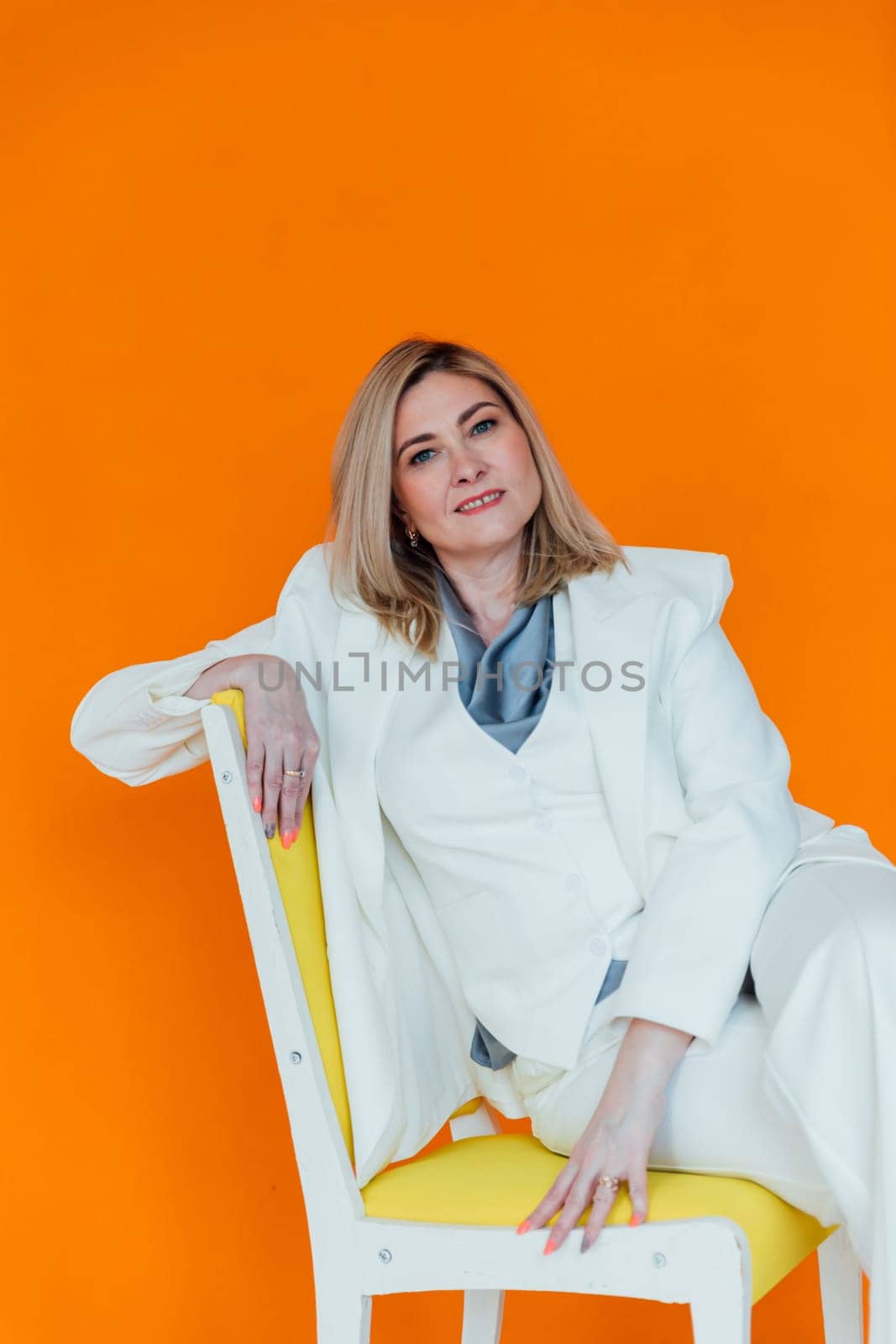 Portrait of a businesswoman in a white business suit