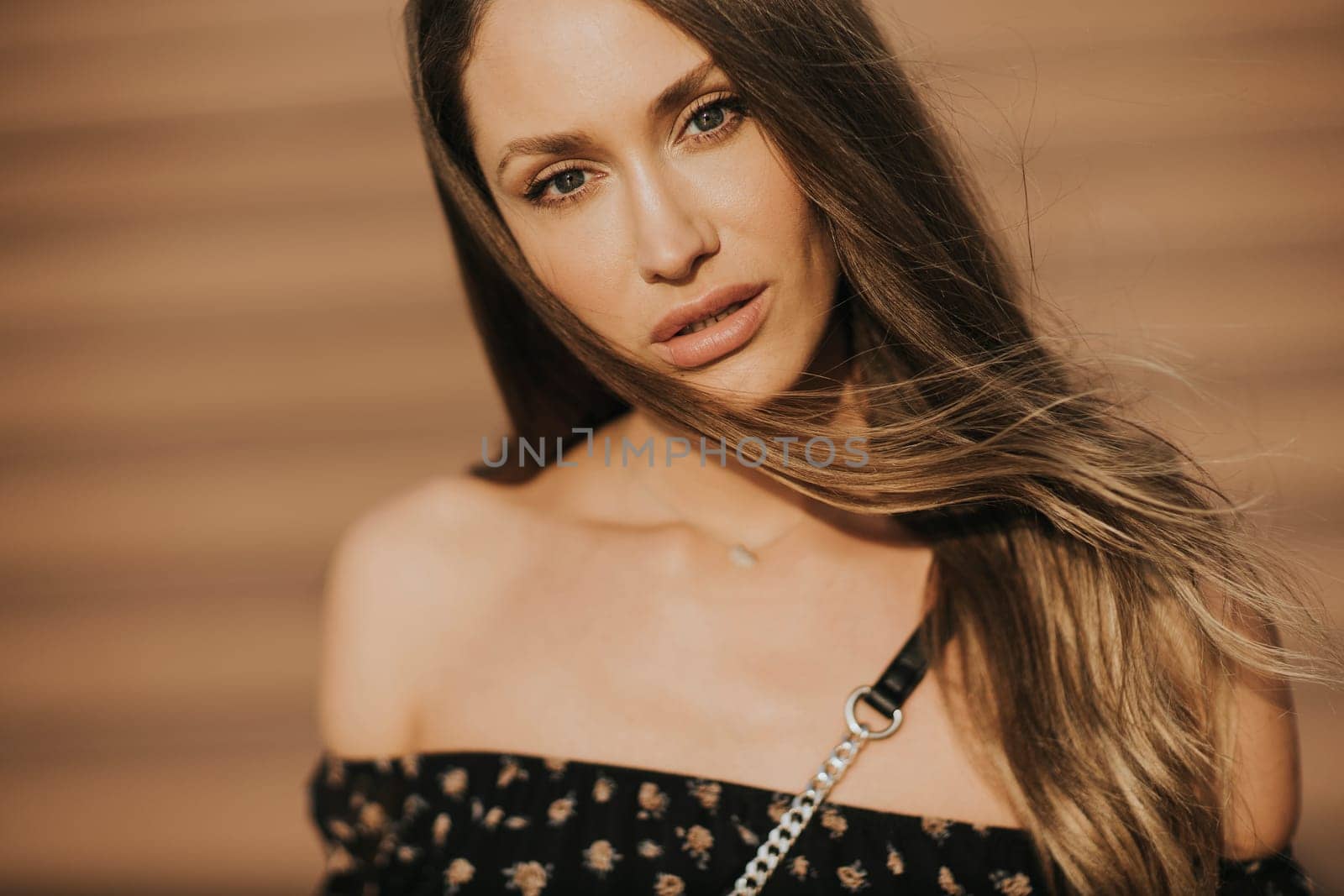 Outdoor portrait of sensual long hair brunette woman