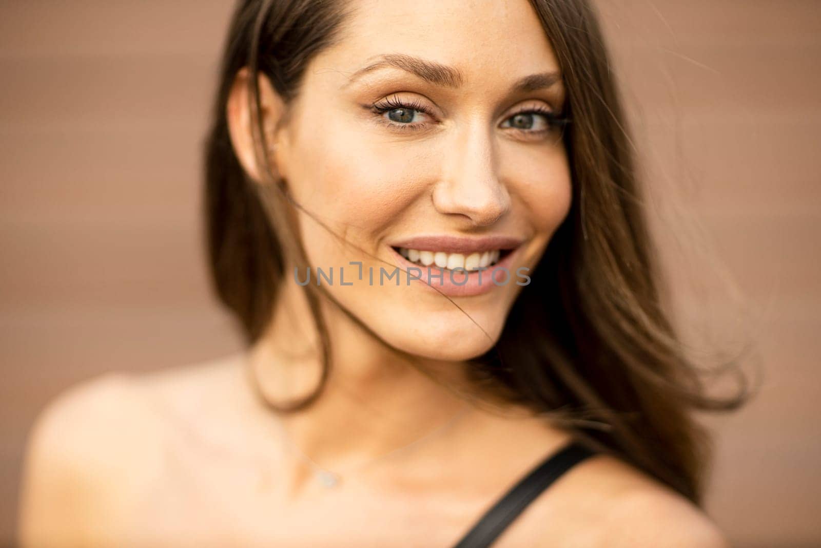 Outdoor portrait of sensual long hair brunette woman