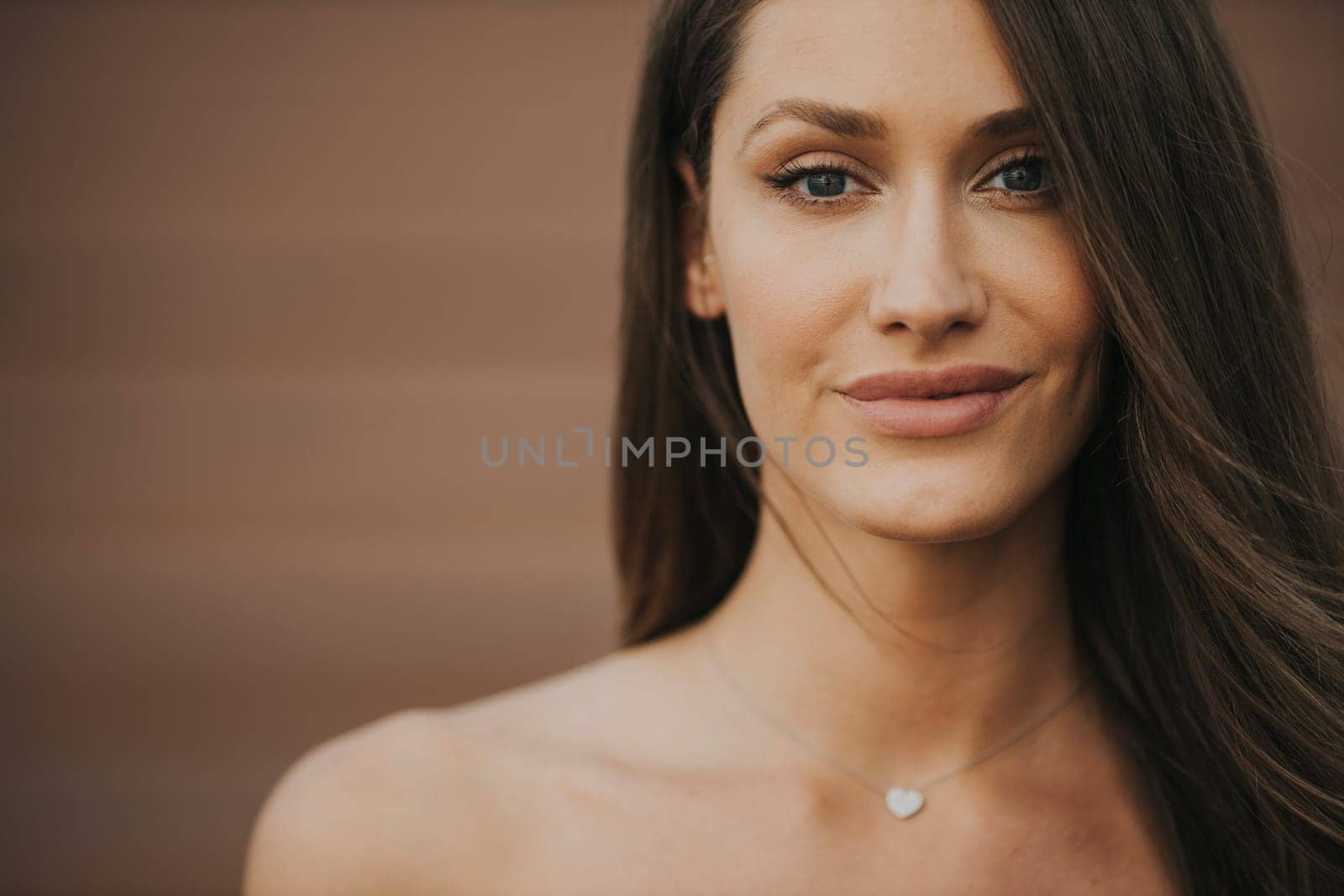 Outdoor portrait of sensual long hair brunette woman