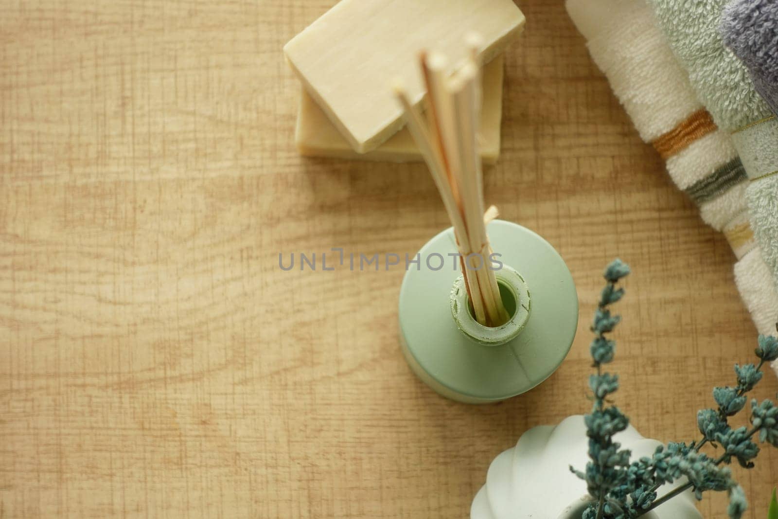 Spa essentials are arranged on a wooden surface, creating a calming atmosphere.