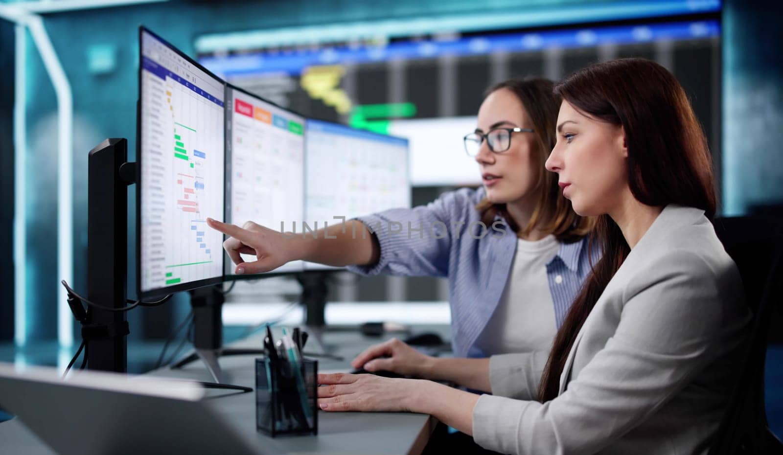 Professional woman managing business calendar and schedule on computer screen
