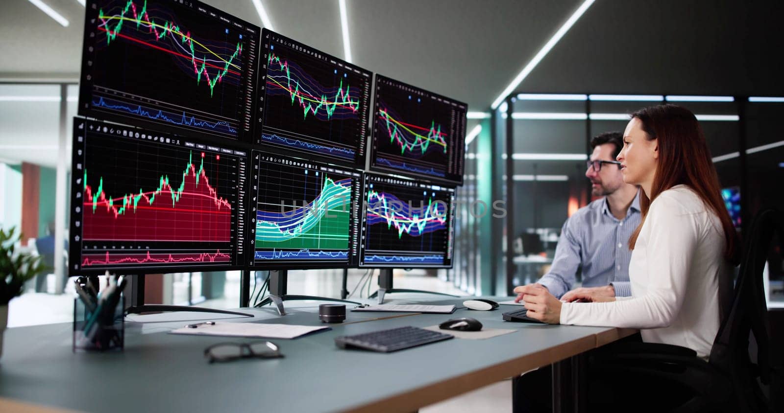 Trading Shares in a Busy Stock Market Exchange on Monitors.
