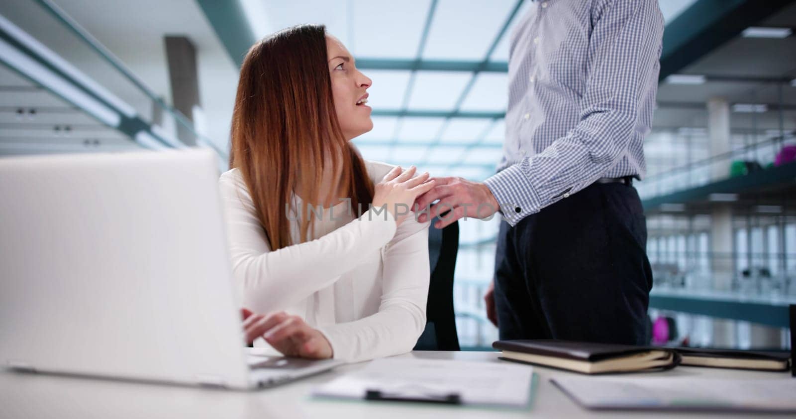Businesswoman defends herself from boss's inappropriate sexual harassment at work.