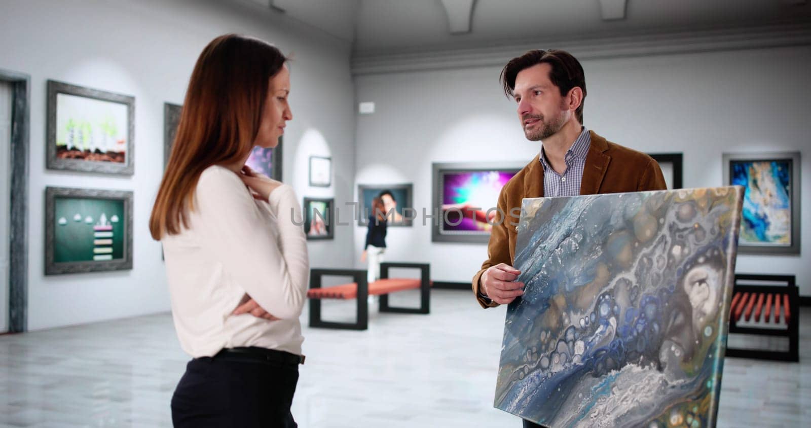 Modern Art Lovers Explore Gallery, Seeking To Purchase Abstract Paintings.