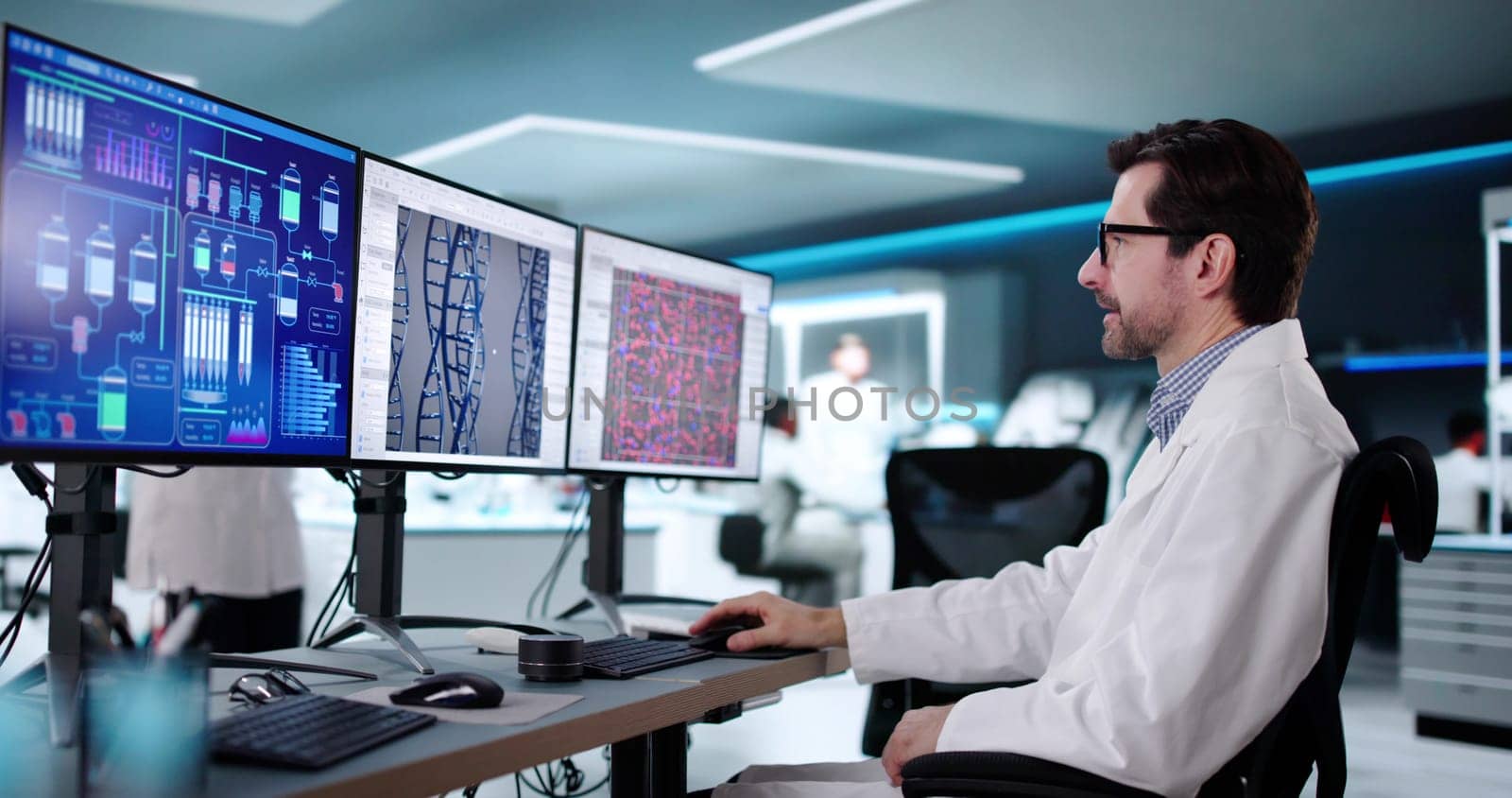 Female scientist researching biotechnology in lab using advanced computer technology.